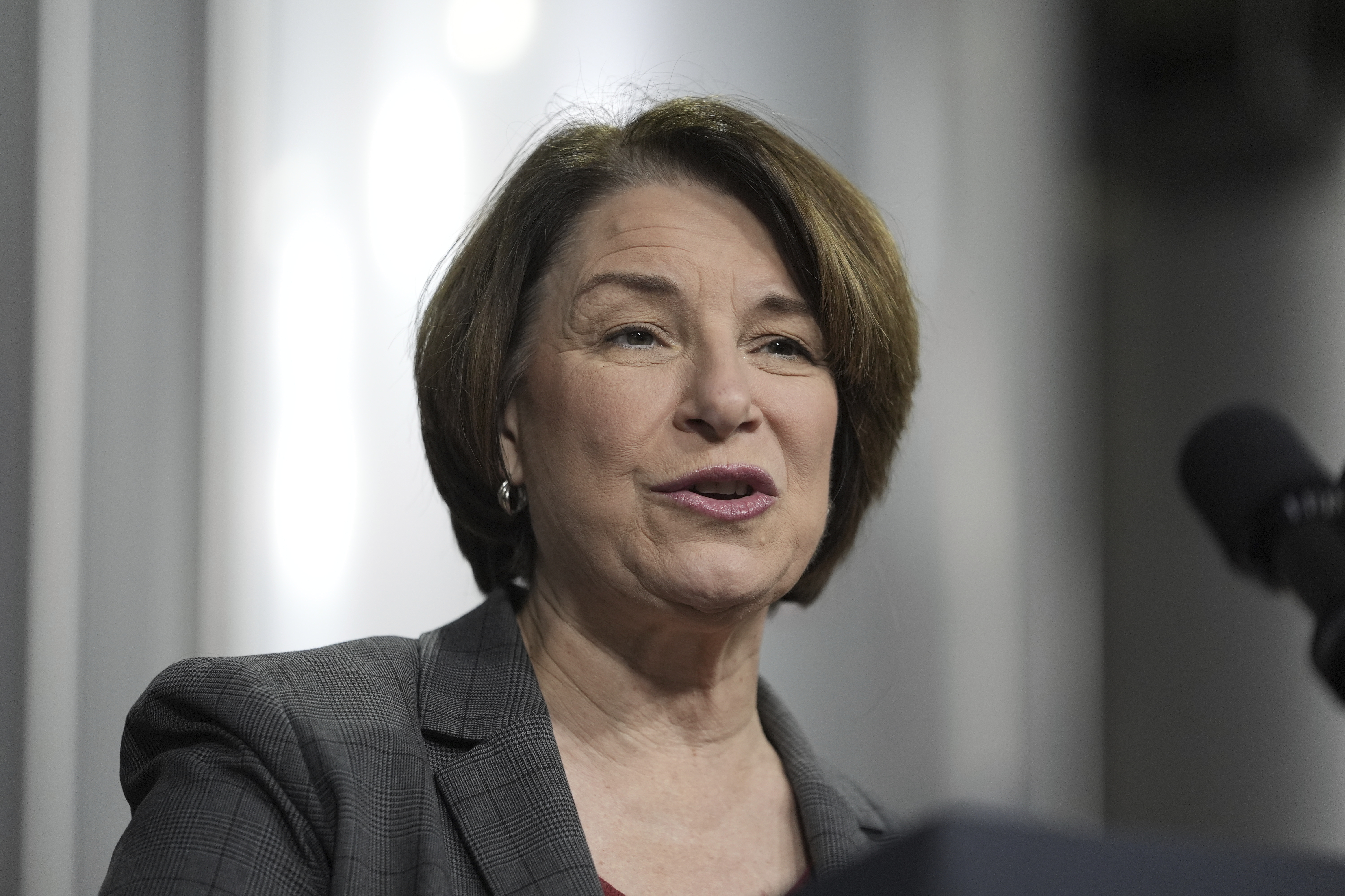 FILE - U.S. Sen. Amy Klobuchar, D-Minn., speaks before President Joe Biden at the Earth Rider Brewery, Jan. 25, 2024, in Superior, Wis. Klobuchar said Friday, July 12, that she remains cancer-free following her bout with breast cancer in 2021, but doctors recently removed a small calcification and that she'll get radiation treatment as a precaution. (AP Photo/Alex Brandon, File)