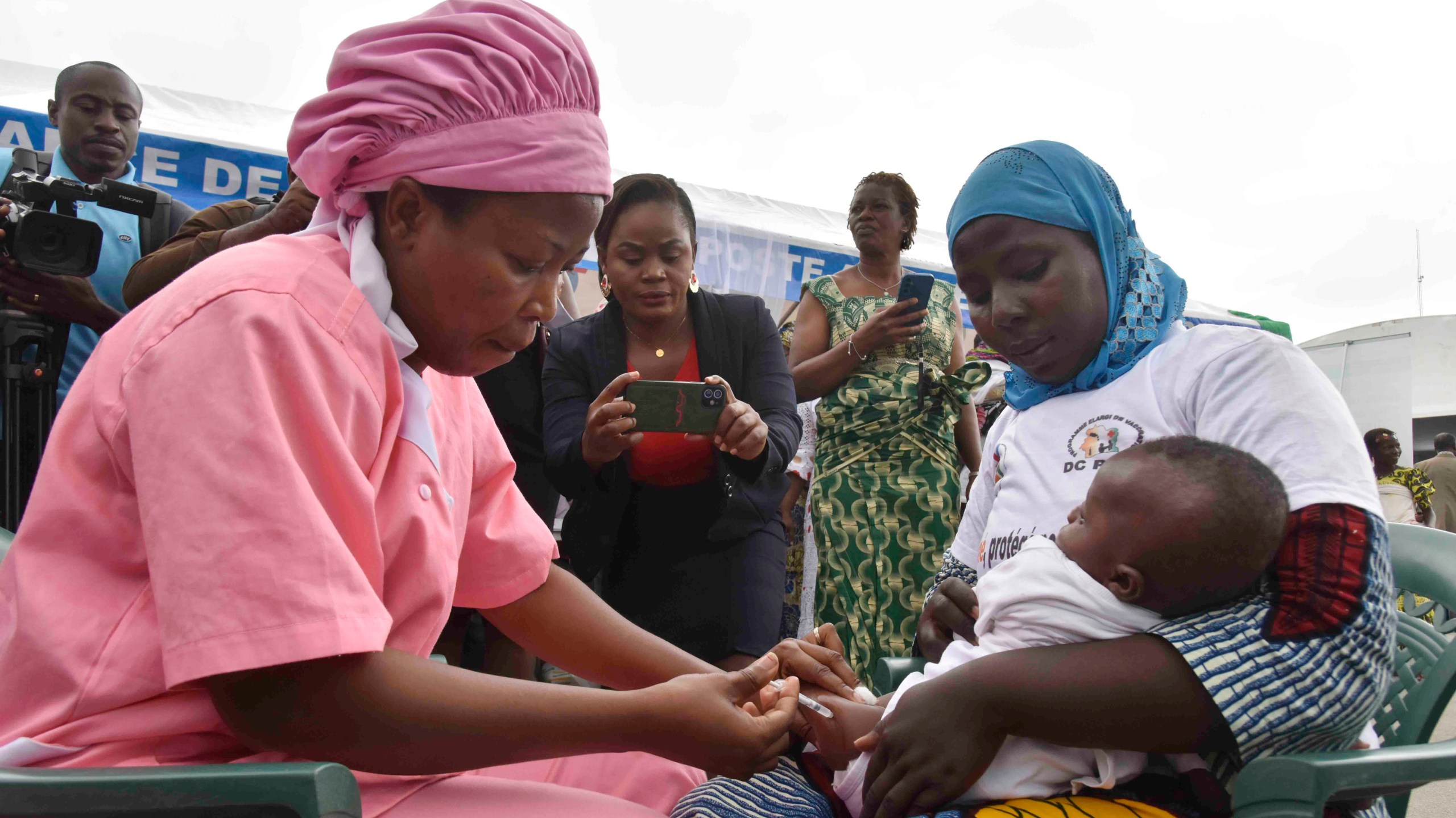 A health worker administers the malaria vaccine Oxford-Serum R21 to a child in Abidjan, Ivory Coast, Monday, July 15, 2024. (AP Photo/Diomande Ble Blonde)