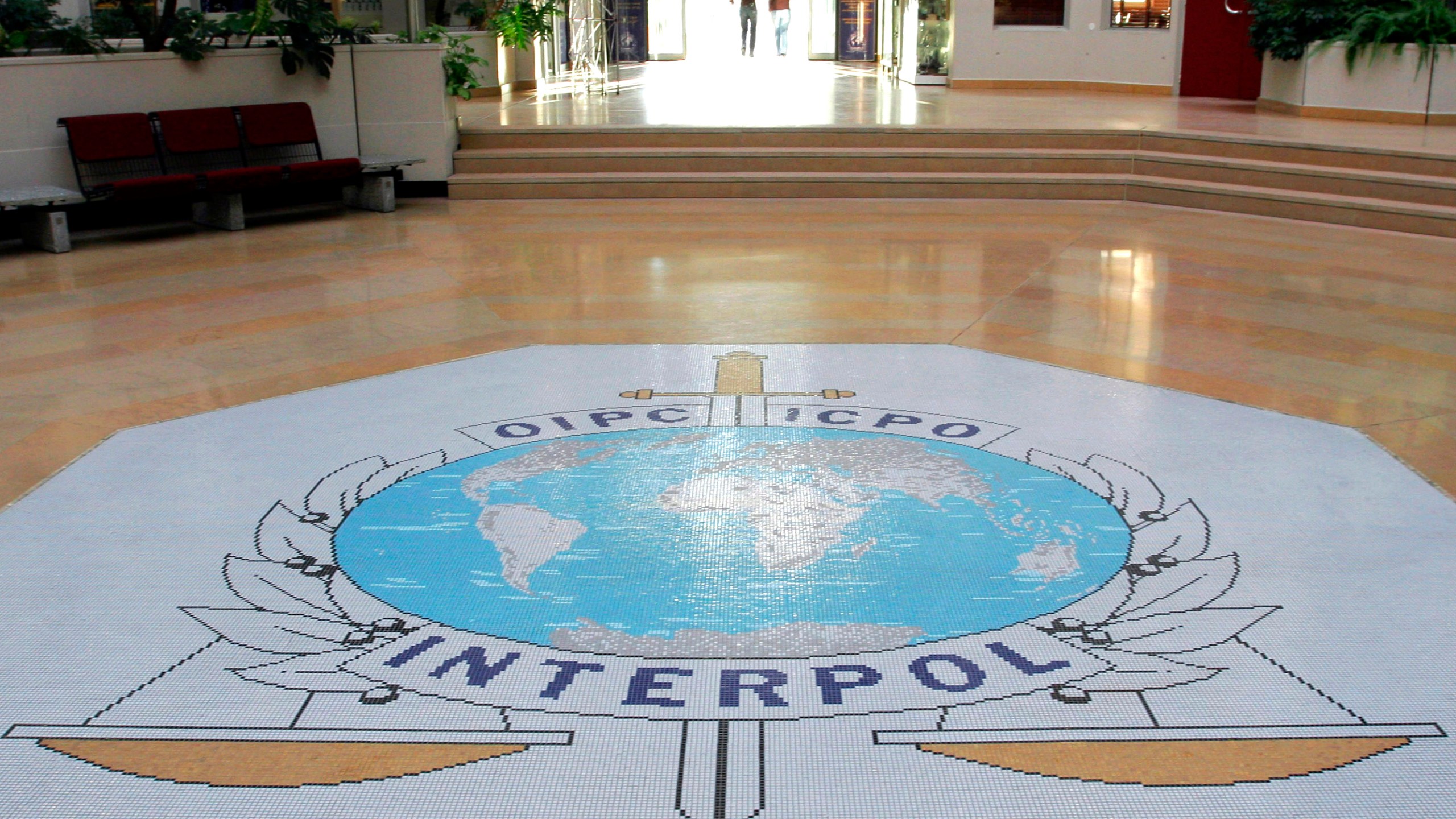 FILE - The entrance hall of Interpol's headquarters in Lyon, central France on Sept. 27, 2017. (AP Photo/Laurent Cipriani, File)