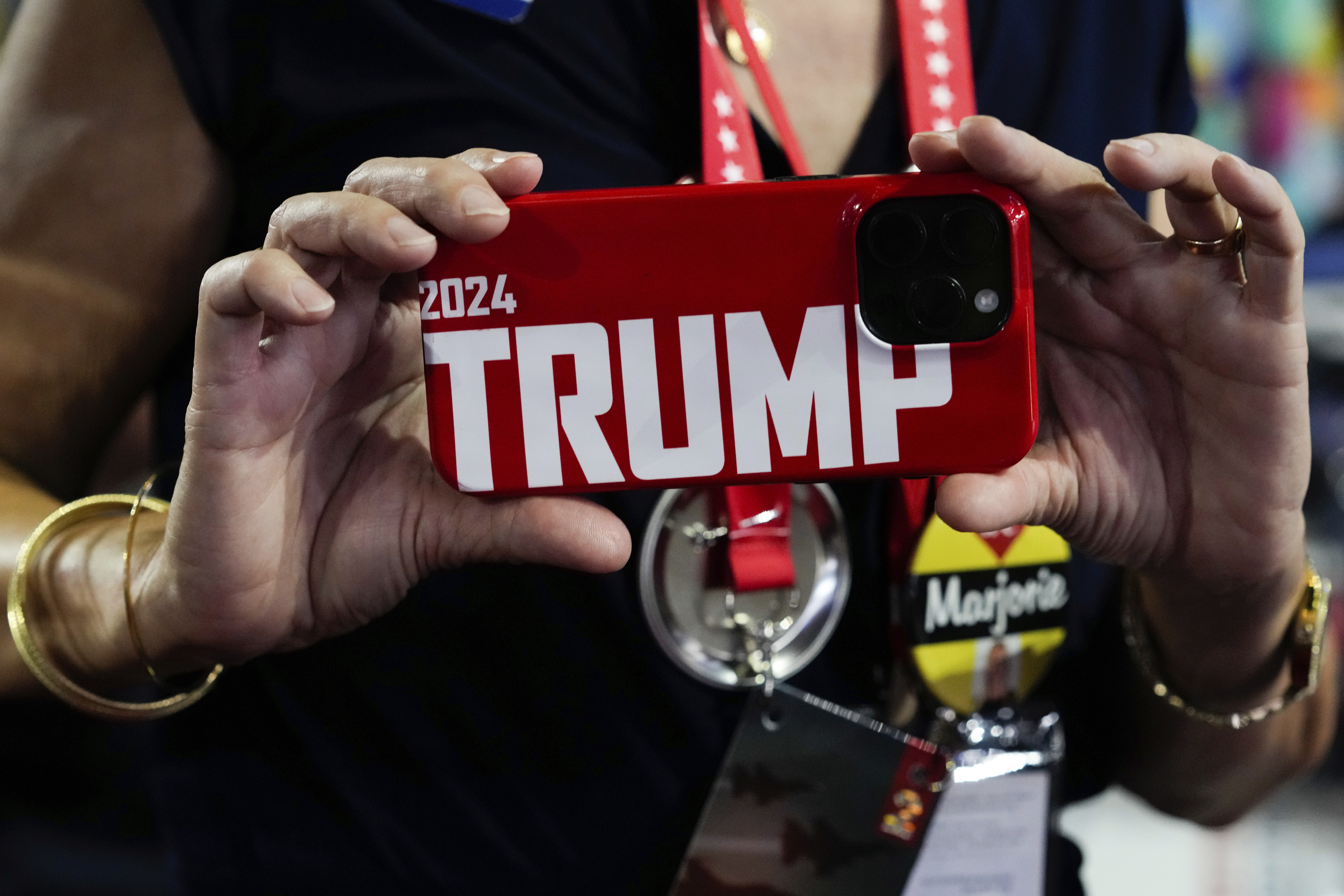 Georgia delegate Kathleen Thornman takes a picture with her phone during the Republican National Convention Tuesday, July 16, 2024, in Milwaukee. (AP Photo/Nam Y. Huh)