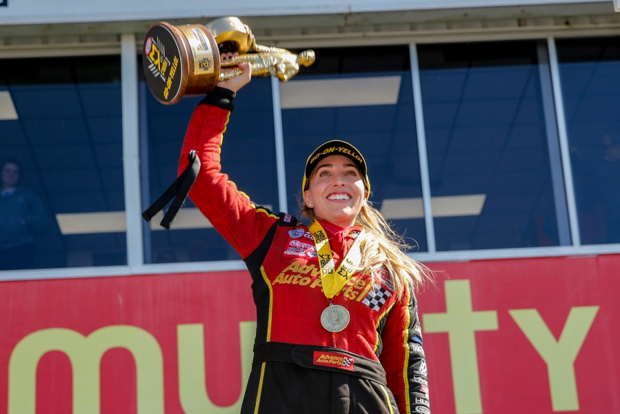 FILE - In this photo provided by the NHRA, Brittany Force celebrates her win in the Top Fuel final in the Mopar Express Lane NHRA SpringNationals in Baytown, Texas, Sunday, April 14, 2019. Brittany Force will return to her Top Fuel dragster this week in Seattle, her first time competing since her father John's horrific accident in Virginia last month. (Randy Anderson/NHRA via AP, File)