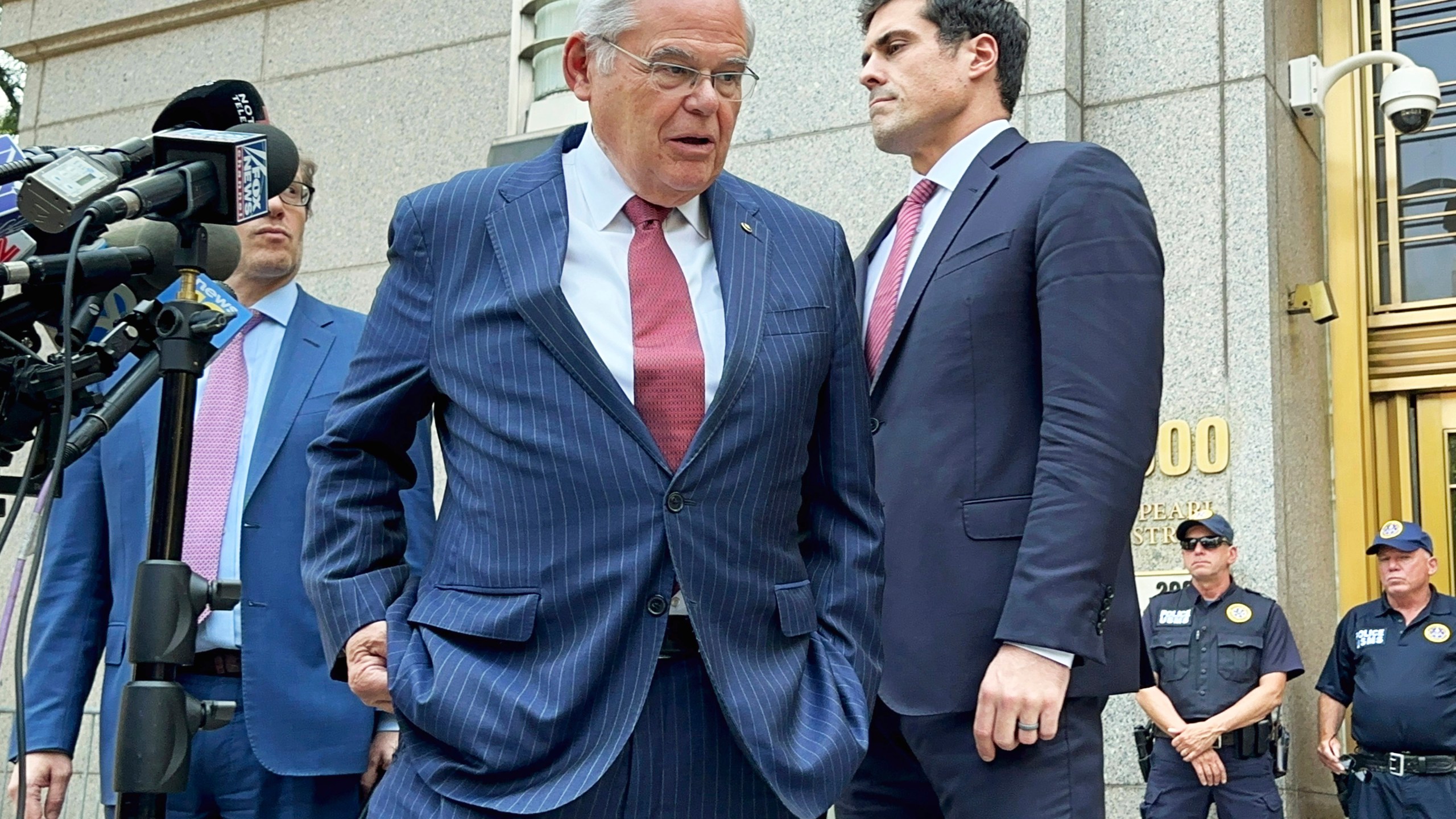 U.S. Sen. Bob Menendez, D-N.J., center, leaves federal court following the day's proceedings in his bribery trial, Tuesday, July 16, 2024, in New York. Menendez has been convicted of all the charges he faced at his corruption trial, including accepting bribes of gold and cash from three New Jersey businessmen and acting as a foreign agent for the Egyptian government. (AP Photo/Larry Neumeister)