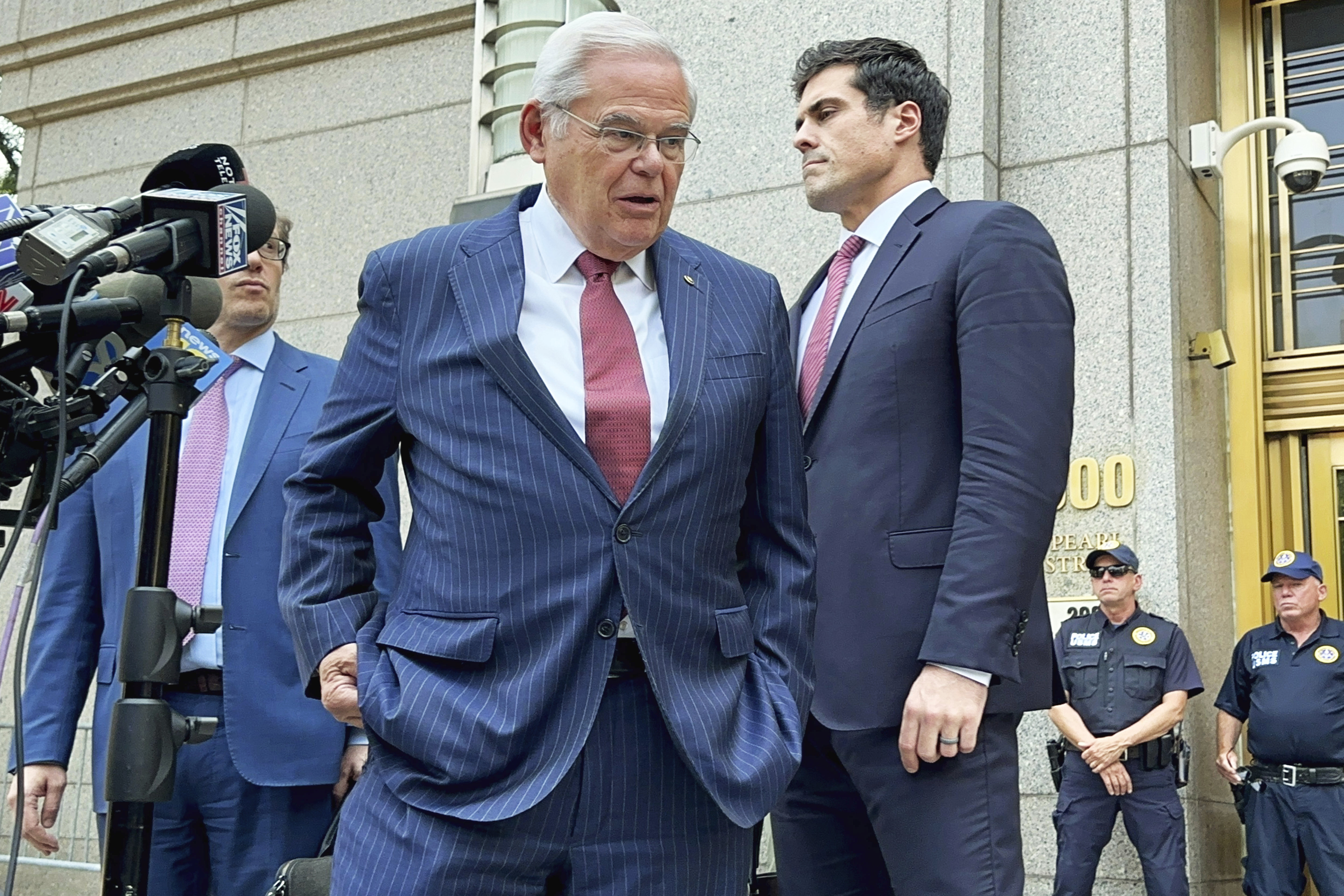 U.S. Sen. Bob Menendez, D-N.J., center, leaves federal court following the day's proceedings in his bribery trial, Tuesday, July 16, 2024, in New York. Menendez has been convicted of all the charges he faced at his corruption trial, including accepting bribes of gold and cash from three New Jersey businessmen and acting as a foreign agent for the Egyptian government. (AP Photo/Larry Neumeister)