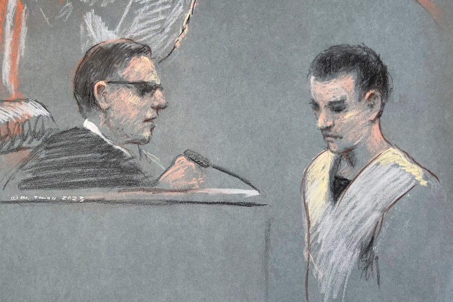 FILE - This artist depiction shows Massachusetts Air National Guardsman Jack Teixeira, right, appearing in U.S. District Court in Boston, April 14, 2023. (Margaret Small via AP, File)