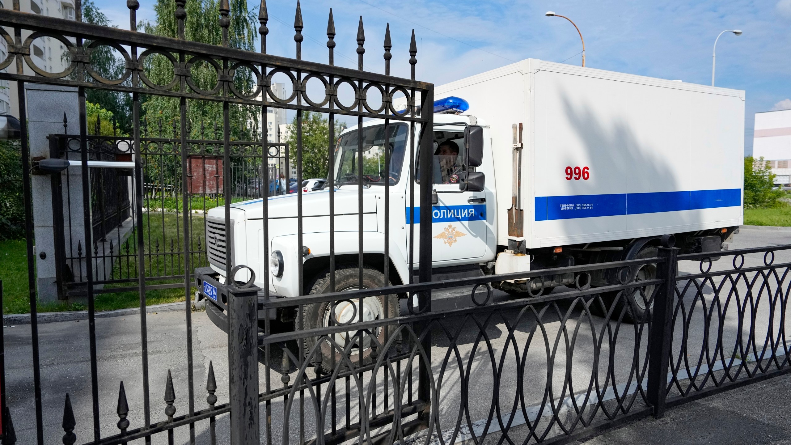 A Russian Federal Bailiffs Service prisoner transport vehicle moves into the courtyard in Yekaterinburg, Russia, Thursday, July 18, 2024, prior to a hearing of Wall Street Journal reporter Evan Gershkovich's suspected spying activities. (AP Photo/Dmitri Lovetsky)