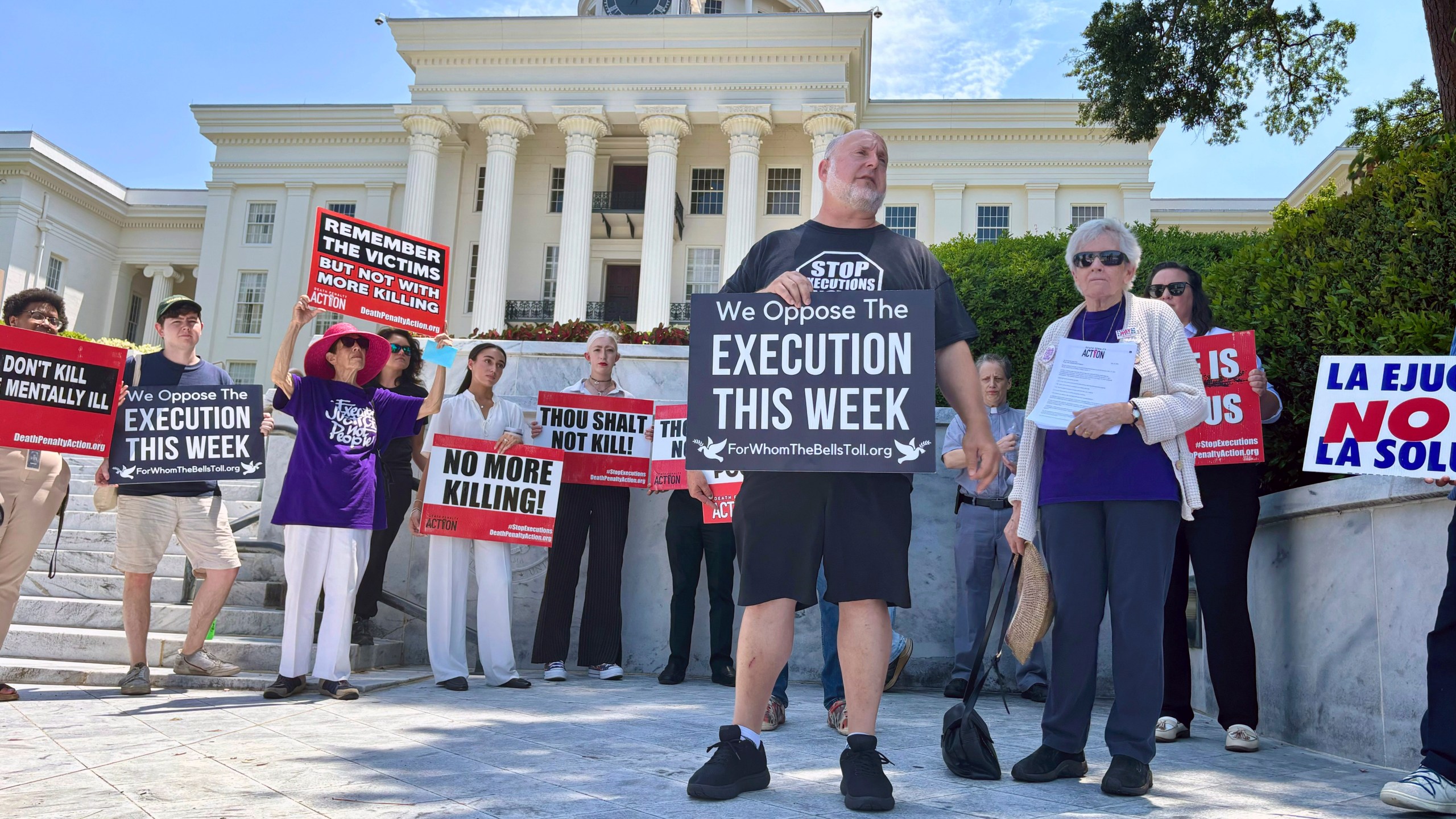 Abraham Bonowitz of Death Penalty Action and Esther Brown of Project Hope to Abolish the Death Penalty in Alabama stand with other death penalty opponents at a Tuesday, July 16, 2024 rally in front of the Alabama Capitol in Montgomery, Ala. (AP Photo/Kim Chandler)