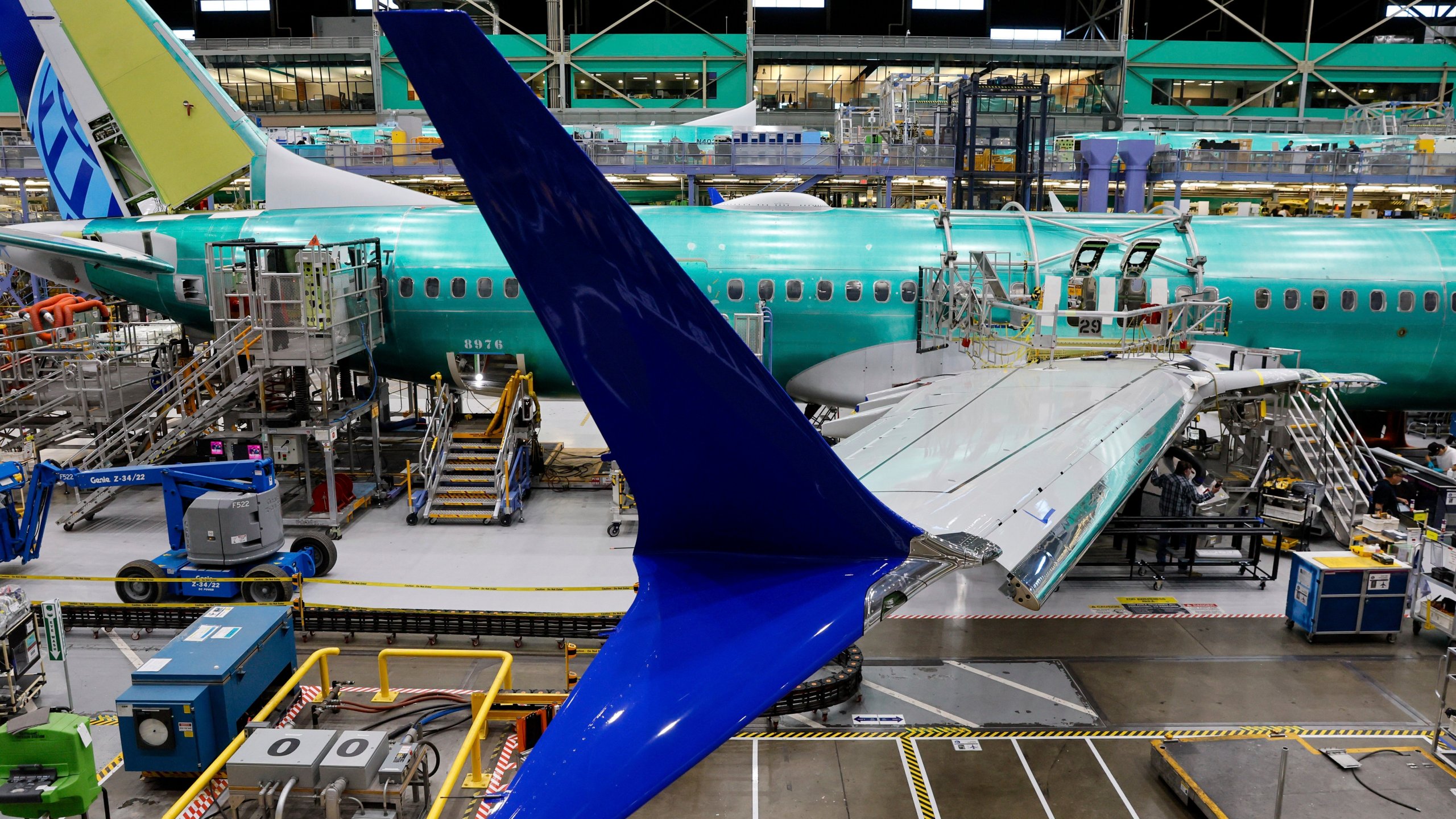 FILE - Boeing 737 MAX airplanes are shown on the assembly line during a media tour at the Boeing facility in Renton, Wash., June 25, 2024. After deadly crashes involving two new airplanes, a 2021 settlement that included a fine failed to have the desired effect of improving safety compliance at Boeing.(Jennifer Buchanan/The Seattle Times via AP, Pool, File)