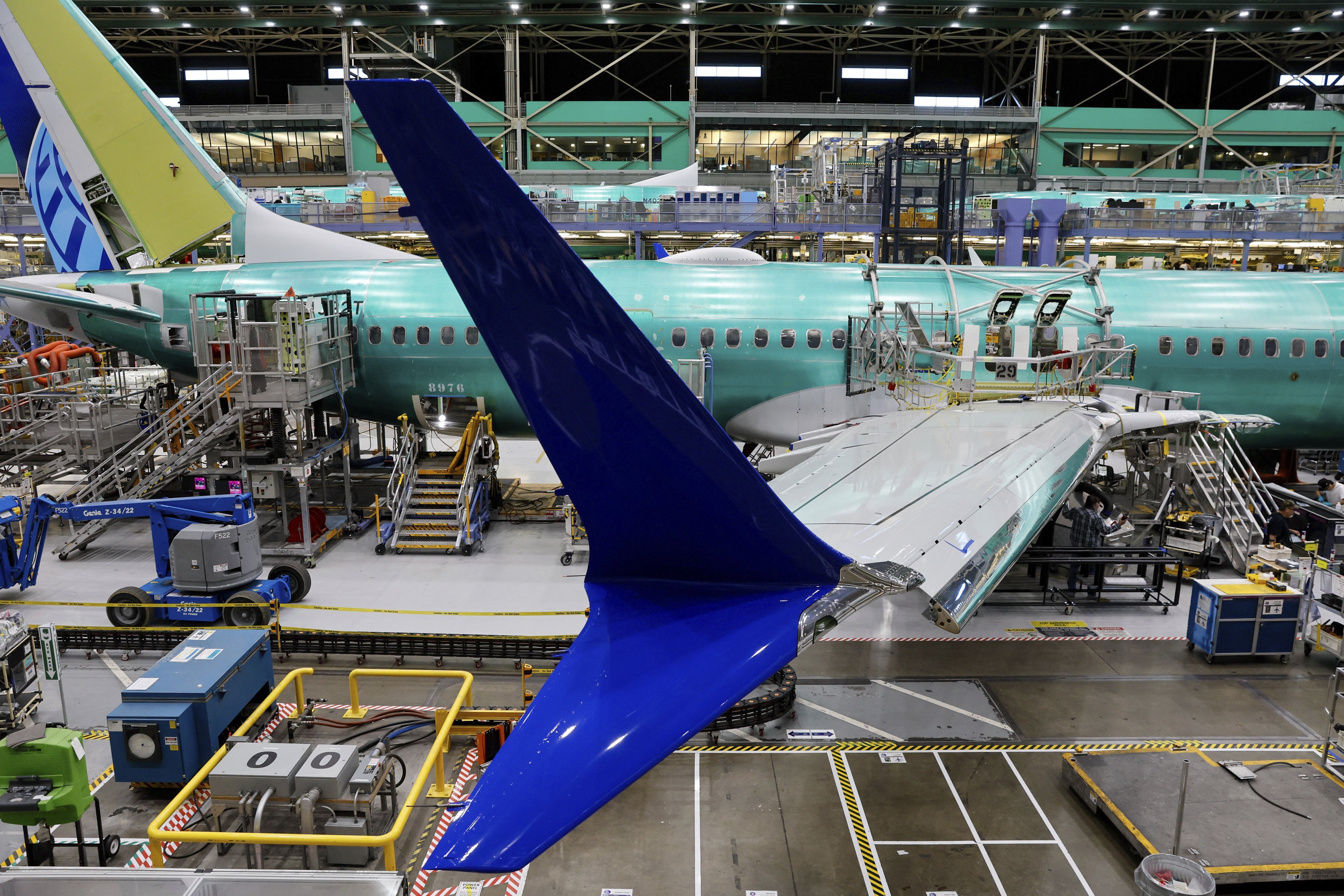 FILE - Boeing 737 MAX airplanes are shown on the assembly line during a media tour at the Boeing facility in Renton, Wash., June 25, 2024. After deadly crashes involving two new airplanes, a 2021 settlement that included a fine failed to have the desired effect of improving safety compliance at Boeing.(Jennifer Buchanan/The Seattle Times via AP, Pool, File)