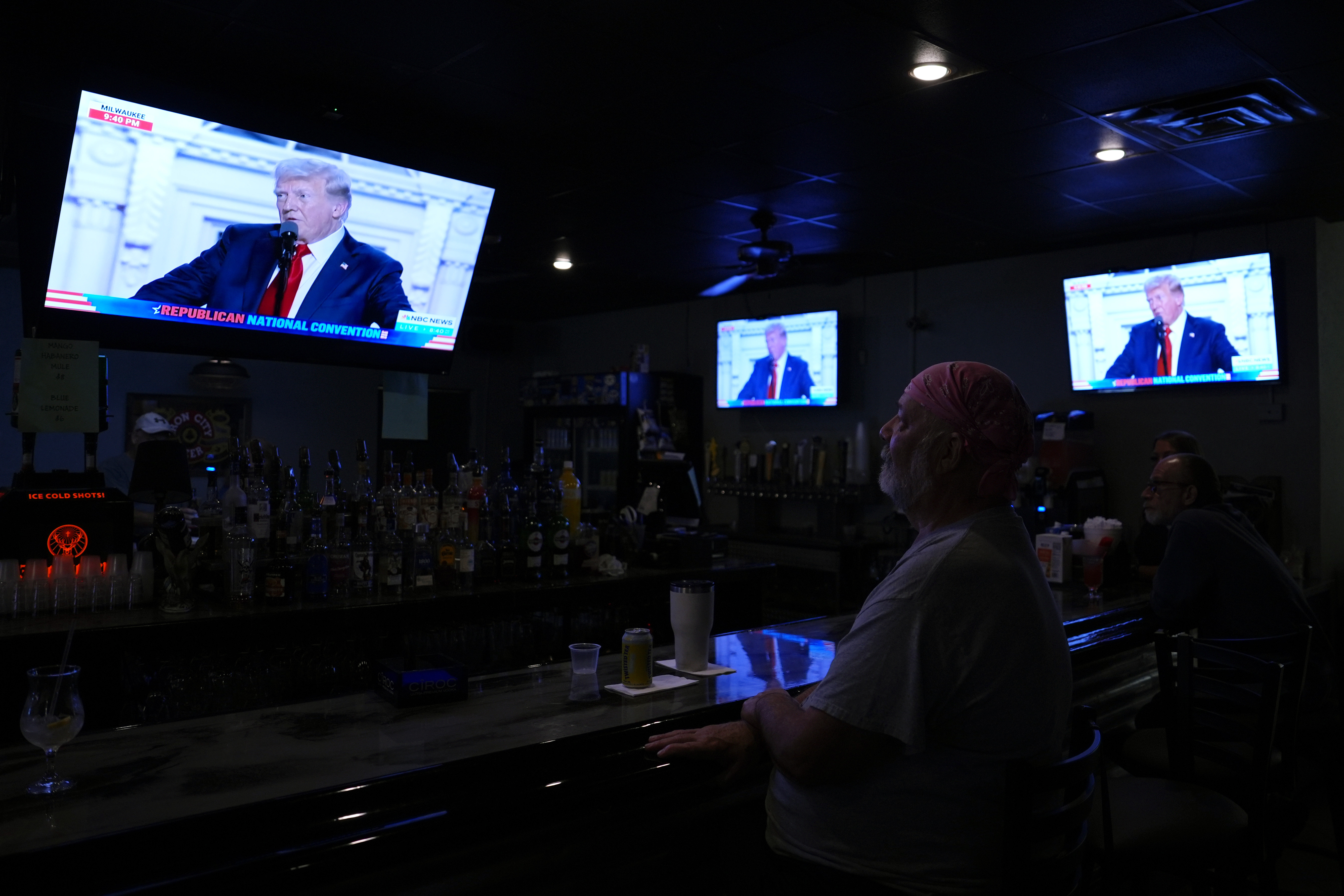 Fred Reese, owner of The Monroe Hotel restaurant and lounge in Butler, Pa., watches as Republican presidential candidate former President Donald Trump delivers a speech at the Republican National Convention, Thursday, July 18, 2024. (AP Photo/Matt Slocum)