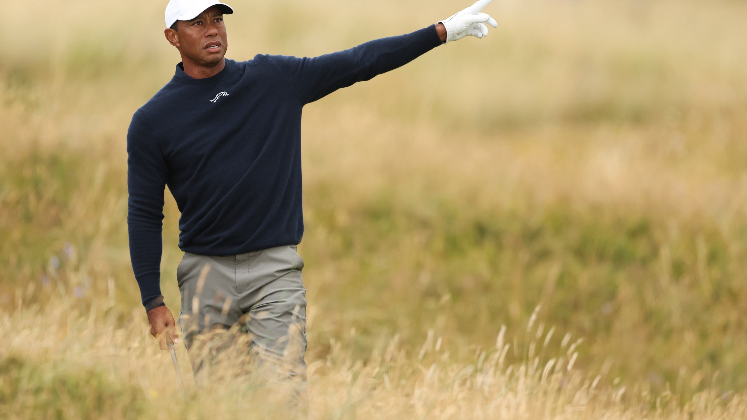 Tiger Woods of the United States gestures after playing from the rough on the sixth hole during his second round of the British Open Golf Championships at Royal Troon golf club in Troon, Scotland, Friday, July 19, 2024. (AP Photo/Peter Morrison)