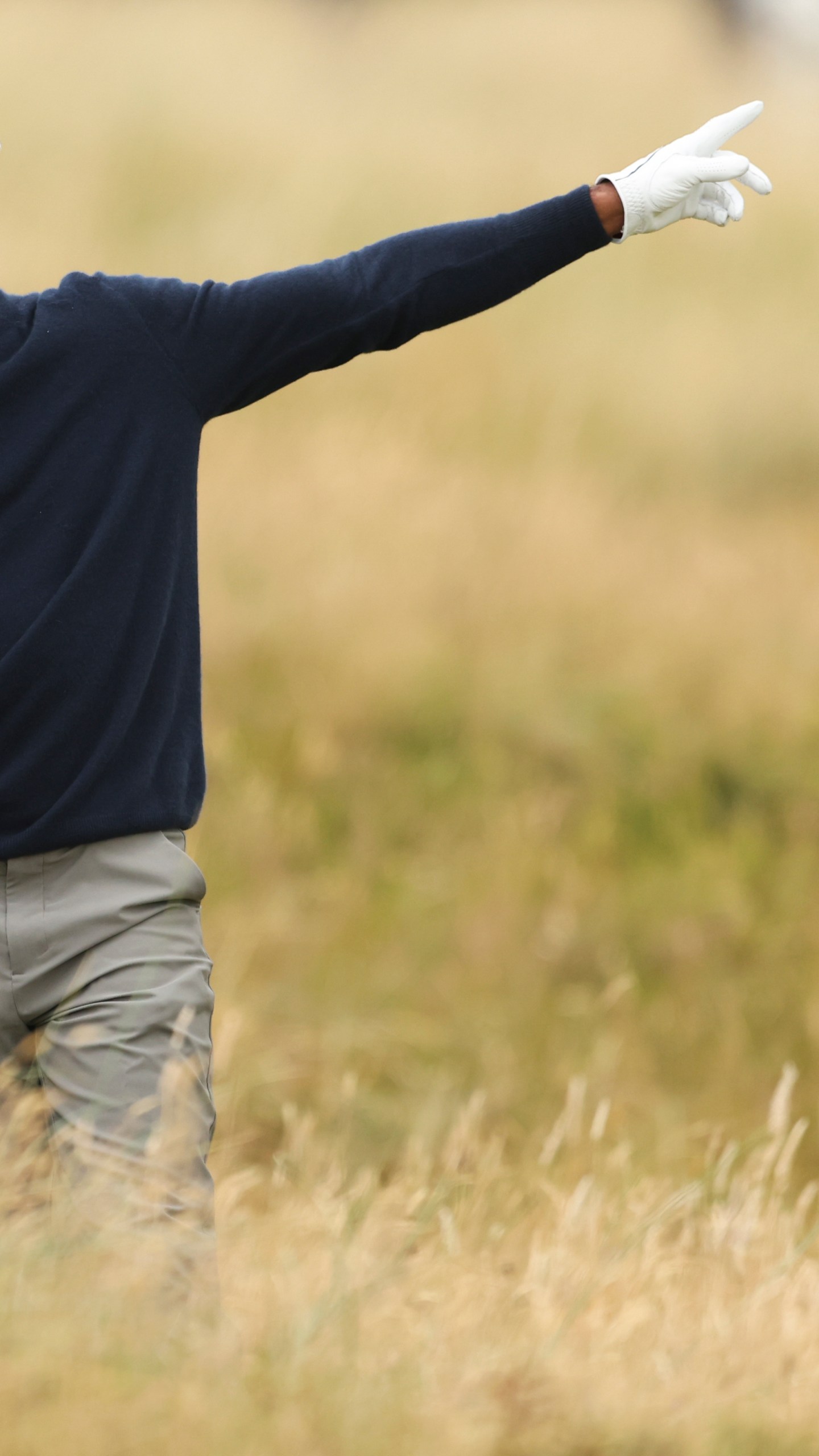 Tiger Woods of the United States gestures after playing from the rough on the sixth hole during his second round of the British Open Golf Championships at Royal Troon golf club in Troon, Scotland, Friday, July 19, 2024. (AP Photo/Peter Morrison)