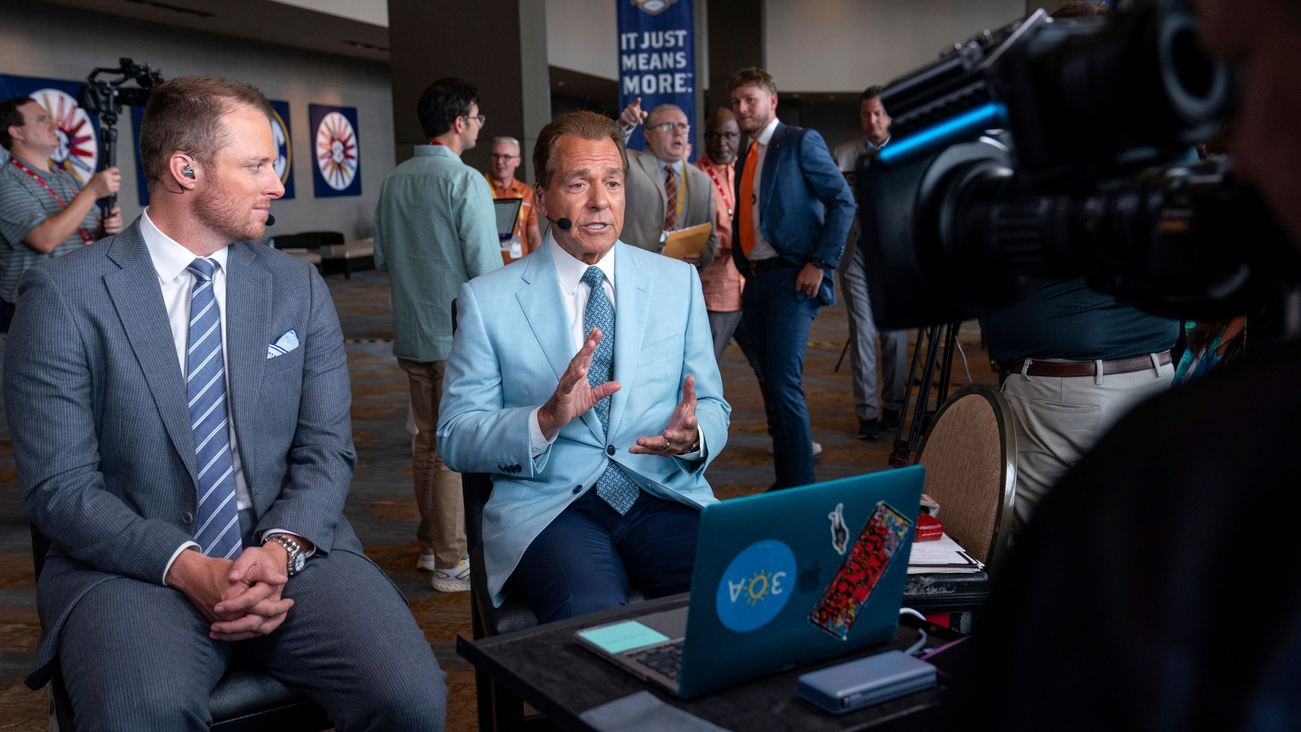 ESPN commentators Nick Saban, right, and Greg McElroy speak during the Southeastern Conference NCAA college football media days Wednesday, July 17, 2024, in Dallas. (AP Photo/Jeffrey McWhorter)