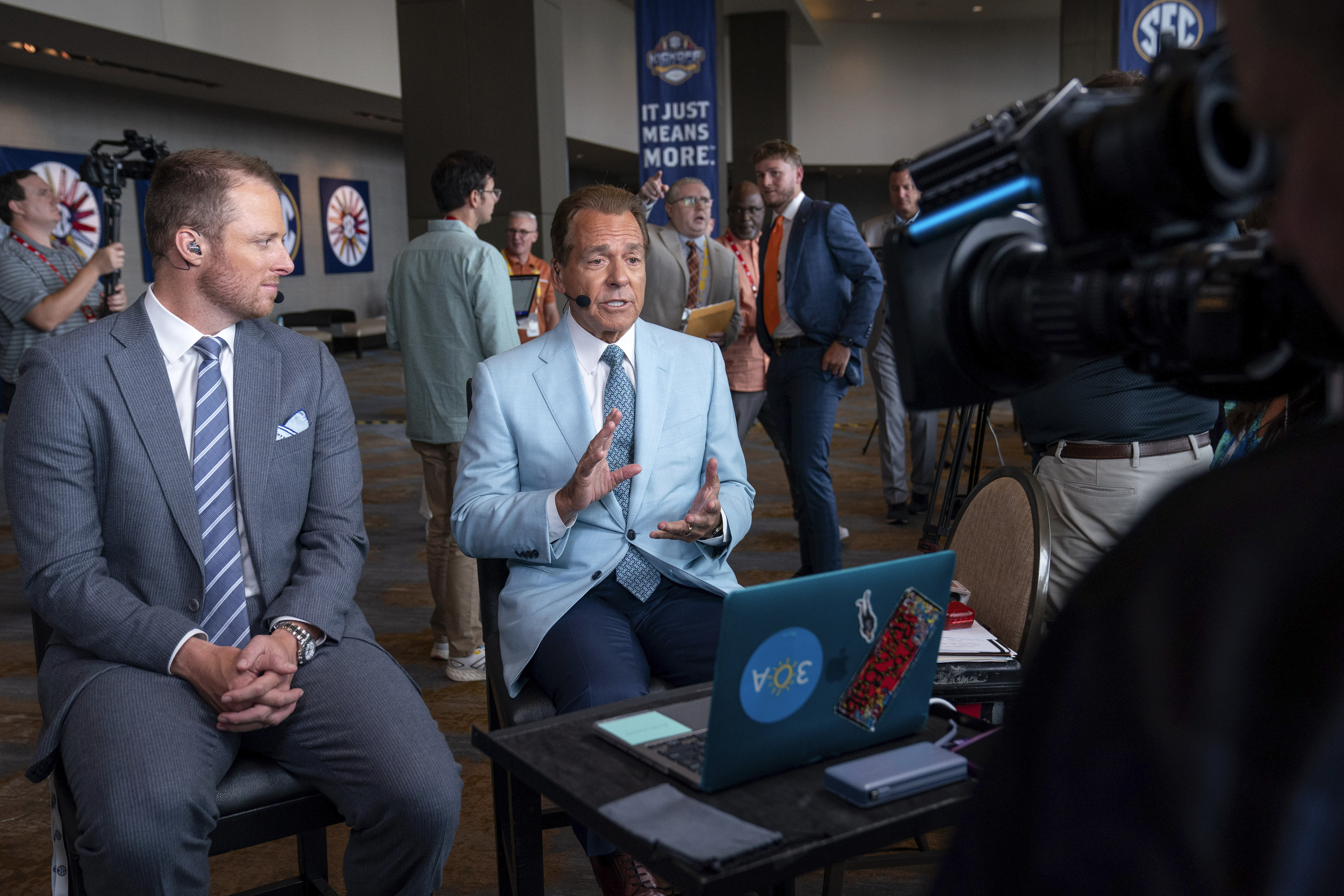 ESPN commentators Nick Saban, right, and Greg McElroy speak during the Southeastern Conference NCAA college football media days Wednesday, July 17, 2024, in Dallas. (AP Photo/Jeffrey McWhorter)