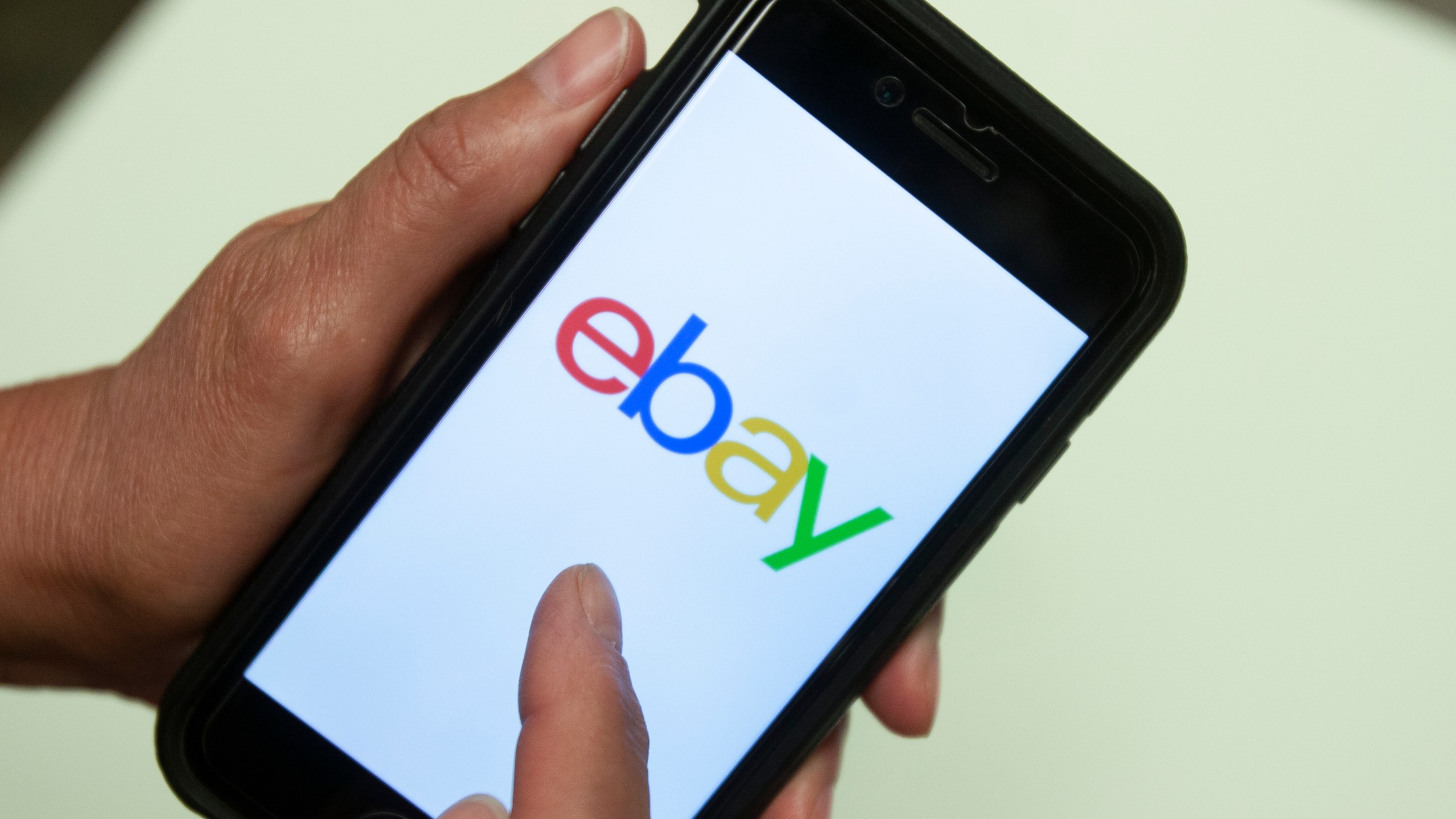 FILE - An eBay app is shown on a mobile phone, July 11, 2019, in Miami. (AP Photo/Wilfredo Lee, File)