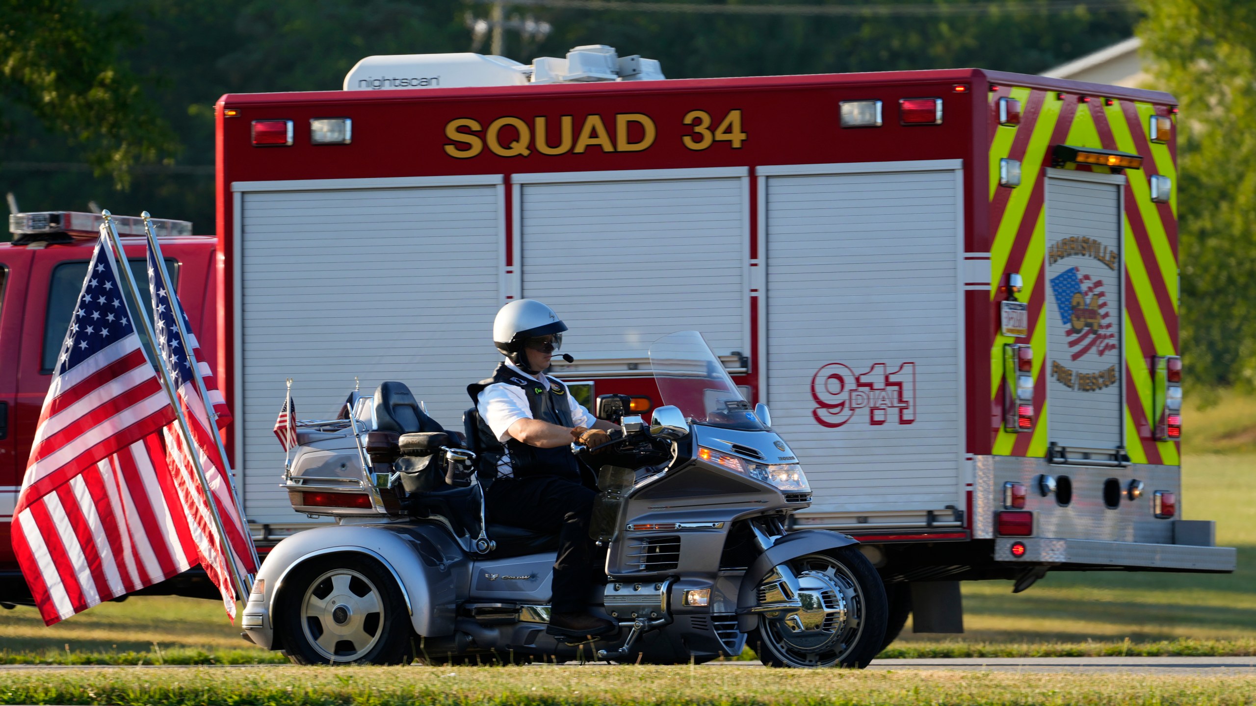 A rider and firefighting truck stage for the funeral procession for Corey Comperatore, Friday, July 19, 2024, in Sarver, Pa. Comperatore, a former fire chief, was shot and killed while attending a weekend rally for former President Donald Trump. (AP Photo/Matt Slocum)