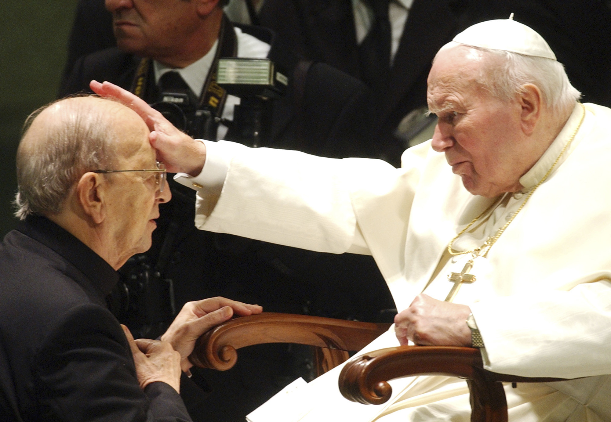 FILE - Pope John Paul II gives his blessing to late father Marcial Maciel, founder of Christ's Legionaries, during a special audience the pontiff granted to about four thousand participants of the Regnum Christi movement, at the Vatican, on Nov. 30, 2004. The recently-opened archives of Pope Pius XII have shed new light on claims the World War II-era pope didn't speak out about the Holocaust. But they're also providing details about another contentious chapter in Vatican history: the scandal over the founder of the Legionaries of Christ. (AP Photo/Plinio Lepri, File)