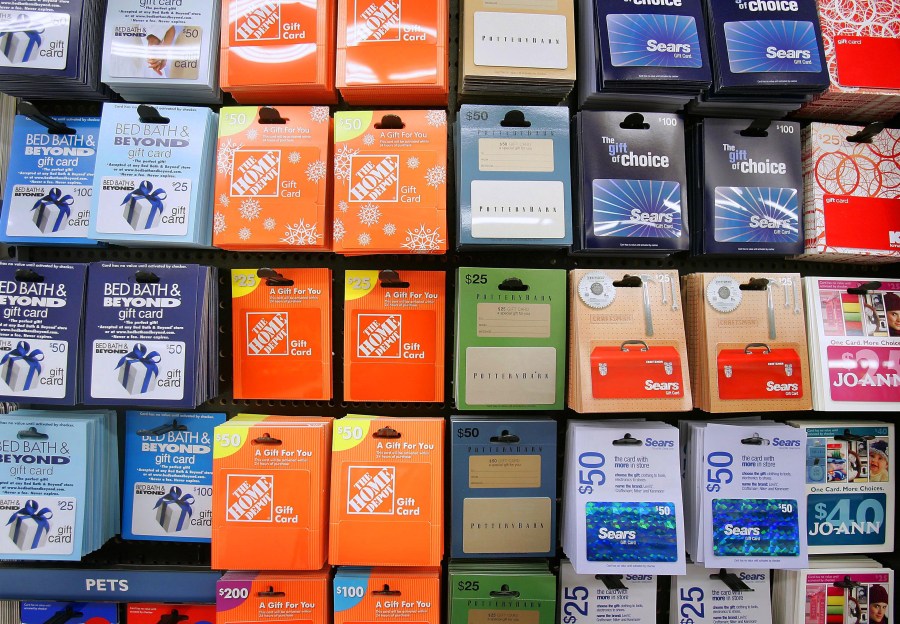 In this Jan. 10, 2008 file photo, a variety of retail gift cards are seen on a kiosk at a store in Santa Clara, California. (AP Photo/Tony Avelar, file)