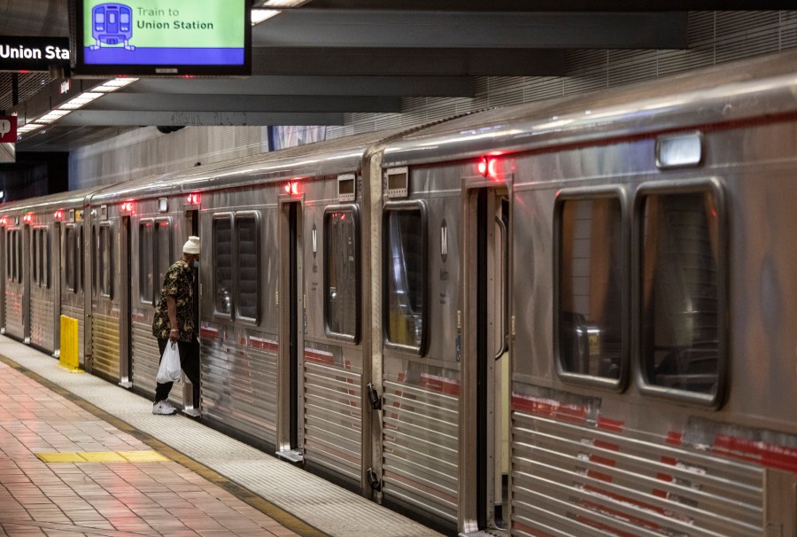 A man hops on an LA Metro B Line (Red) train at North Hollywood Station on Thursday, May 20, 2021 in Los Angeles, CA. (Getty Images)