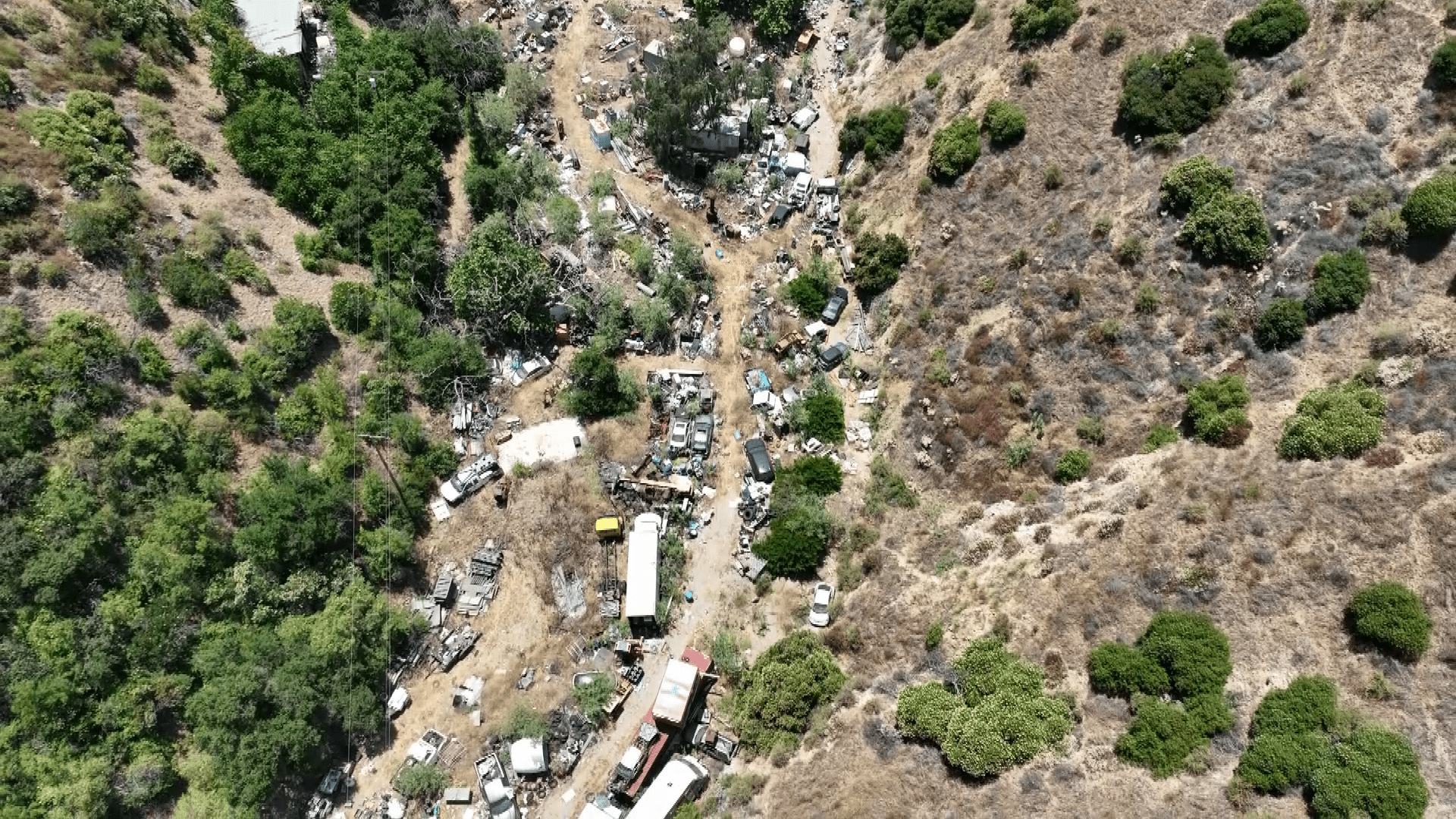 A family in Sun Valley is feeling trapped by a neighbor's sprawling and constantly growing junk collection as seen on July 8, 2024. (KTLA)