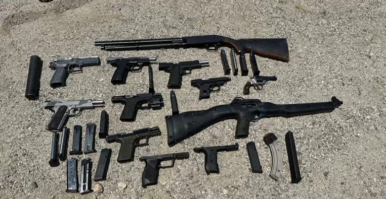 An array of firearms are shown in this undated photo provided by the San Bernardino County Sheriff's Department. The firearms were recovered as part of a gang sweep in late June and early July 2024.