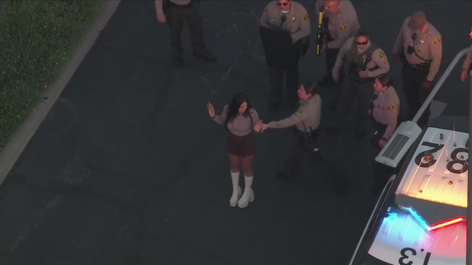 The female passenger also stepped out and surrendered to deputies. (KTLA)