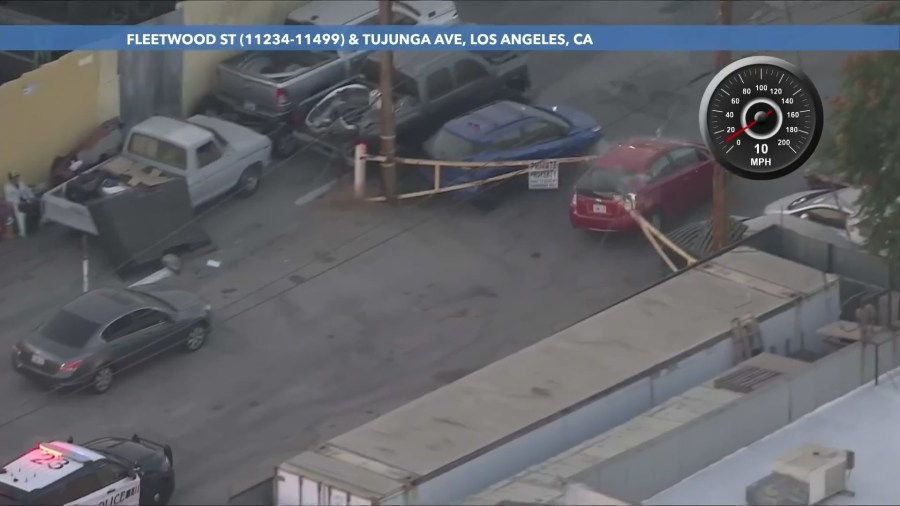 The suspect turned onto a dead-end street and rammed a metal gate. (KTLA)