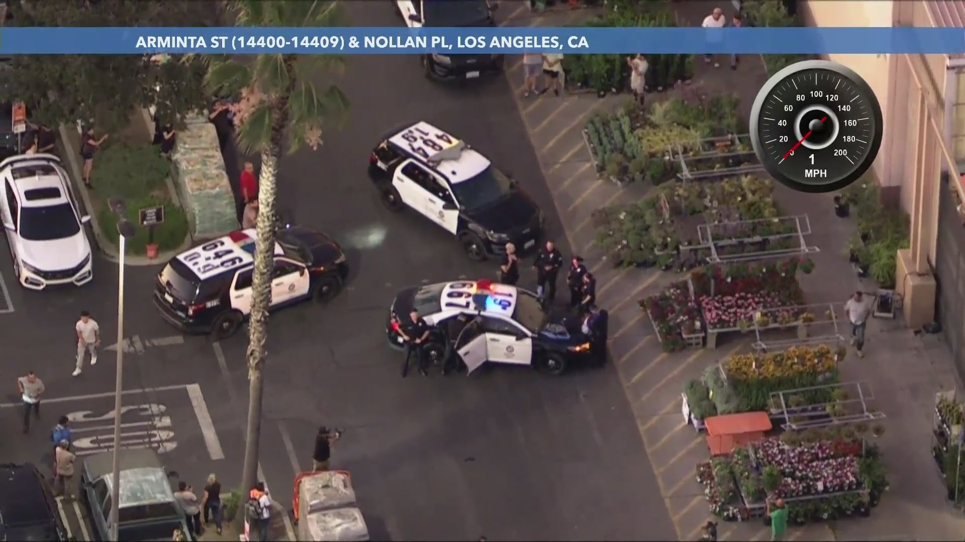 The suspect was taken into custody after police found him inside the Home Depot store. He had taken off a yellow sweater in an attempt to blend in. (KTLA)