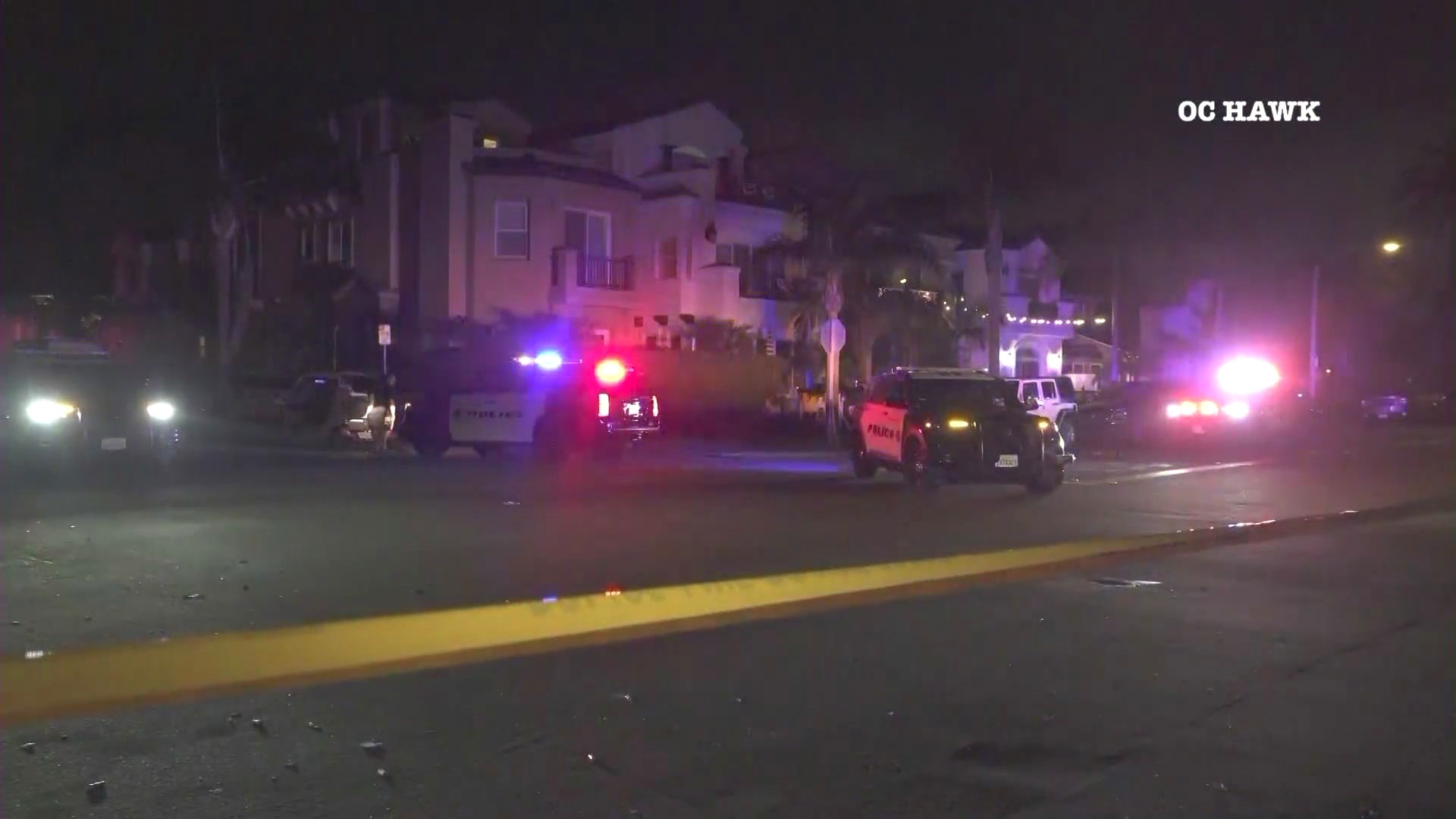 Police investigate outside a Huntington Beach apartment complex where a mass stabbing left two people dead and three others hospitalized on July 4, 2024. (OC Hawk)