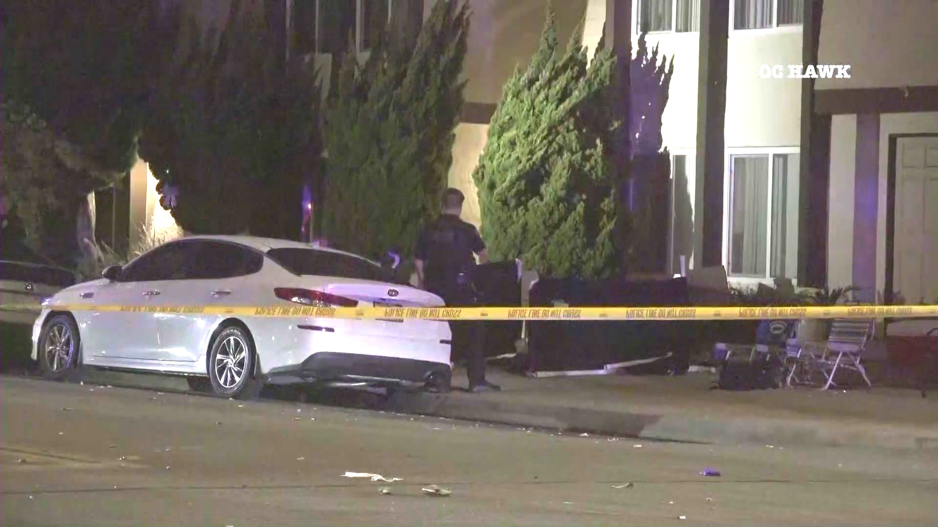 Police investigate outside a Huntington Beach apartment complex where a mass stabbing left two people dead and three others hospitalized on July 4, 2024. (OC Hawk)