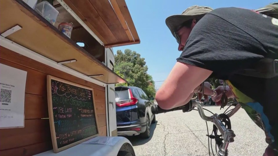 Customers enjoying drinks from the Ka-Ibigan Cafe coffee cart in Altadena on July 9, 2024. (KTLA)