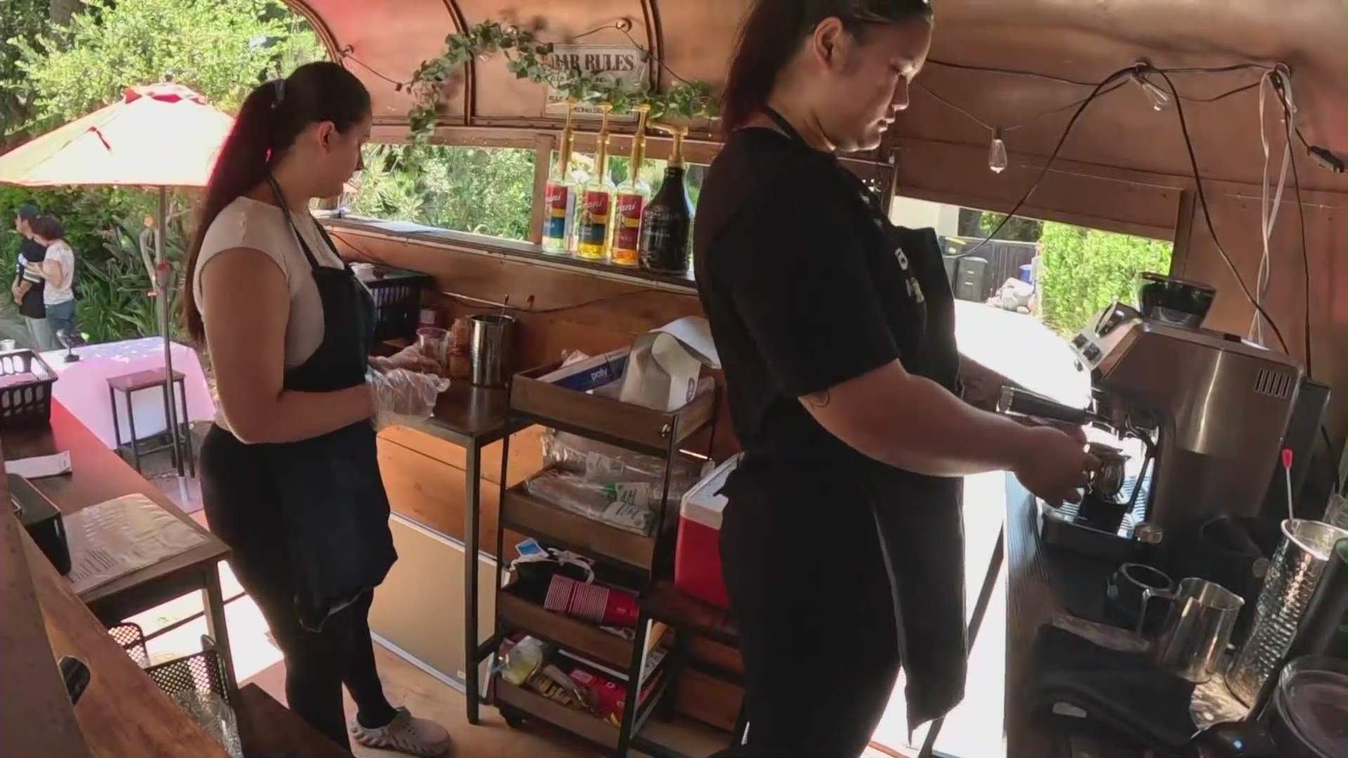 The young entrepreneurs of Ka-Ibigan Cafe serving handcrafted coffee drinks in Altadena. (KTLA)