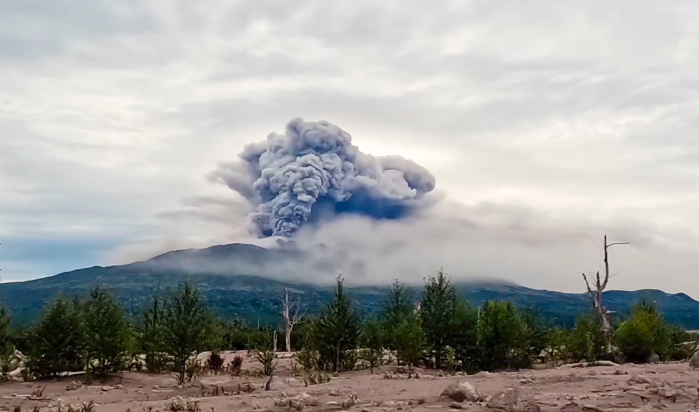 In this photo taken from AP video, provided by by the Institute of Volcanology and Seismology of the Far Eastern Branch of the Russian Academy of Sciences on Sunday, Aug. 18, 2024, the eruption of the Shiveluch volcano is seen in Kamchatka Peninsula, about 500 km (310 miles) north to Petropavlovsk-Kamchatsky, Russia. (Institute of Volcanology and Seismology of the Far Eastern Branch of the Russian Academy of Sciences video via AP)