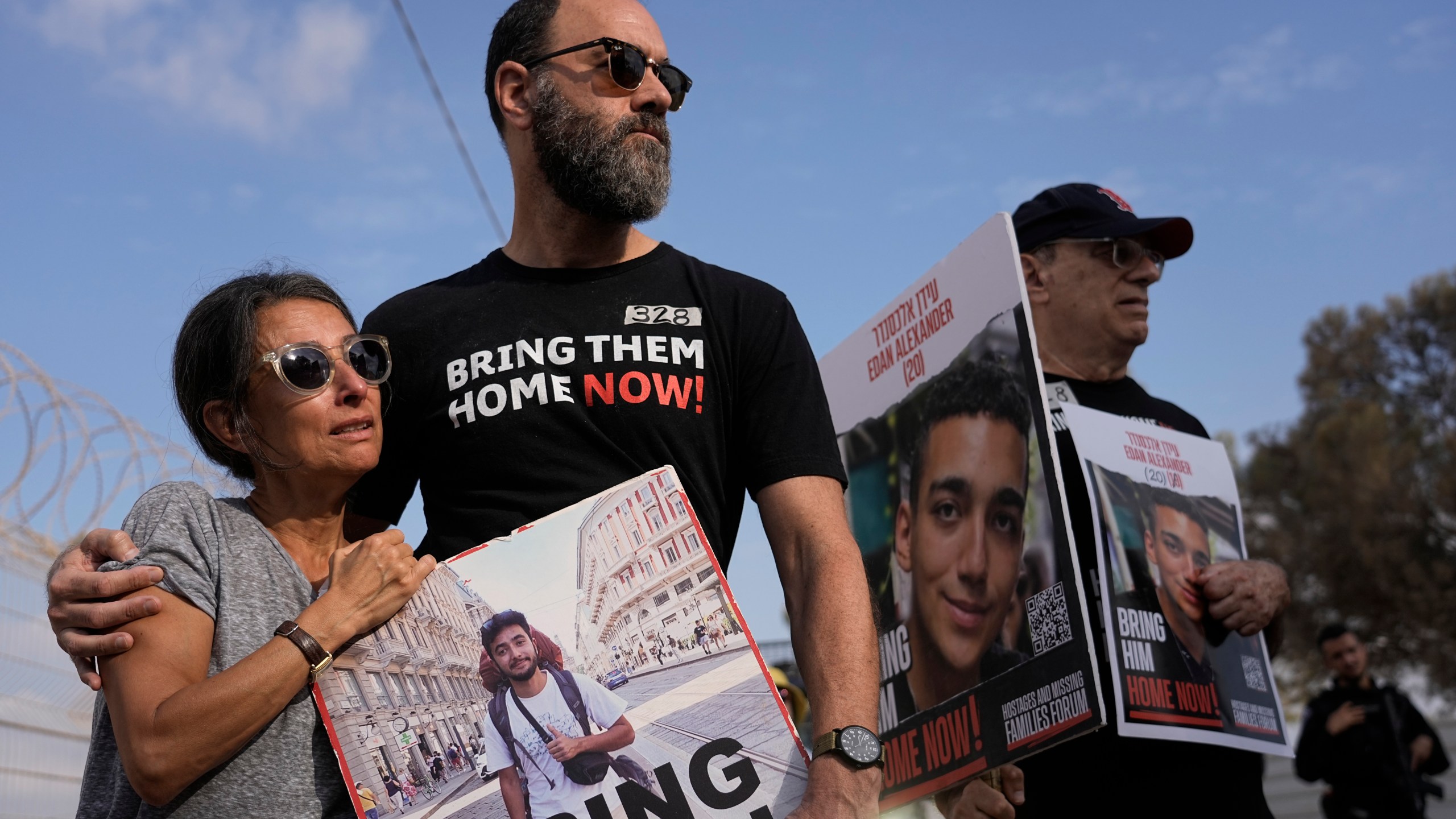 Rachel Goldberg, left, and Jon Polin center, parents of Israeli-American hostage Hersh Polin-Goldberg, along with other relatives of hostages held in the Gaza Strip by the Hamas militant group take part in a protest calling for their release in the Kibbutz Nirim, southern Israel, Thursday, Aug. 29, 2024. (AP Photo/Tsafrir Abayov)