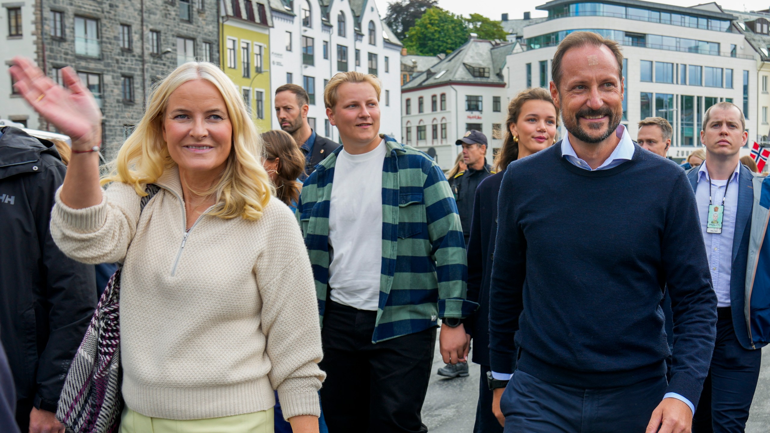 Norway's Crown Prince Haakon, Crown Princess Mette-Marit and their son Prince Sverre Magnus, center, arrive at the boats in Alesund, Norway, Friday Aug. 30, 2024, to transport them to Geiranger for the wedding celebration of Princess Martha Louise and Durek Verret on Saturday. (Heiko Junge/NTB via AP)