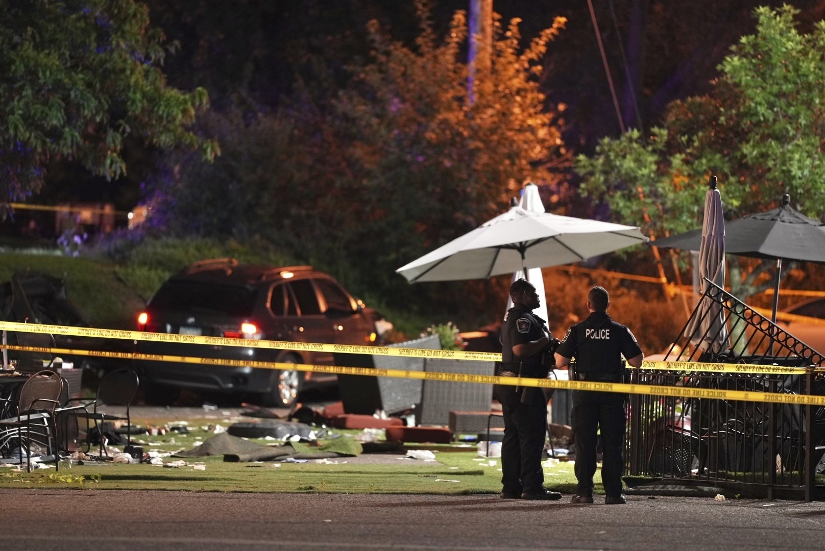 Police are shown at the scene where a car drove into the patio seating area of Park Tavern in St. Louis Park, Minn., Sunday night, Sept. 1, 2024. (Jeff Wheeler/Star Tribune via AP)