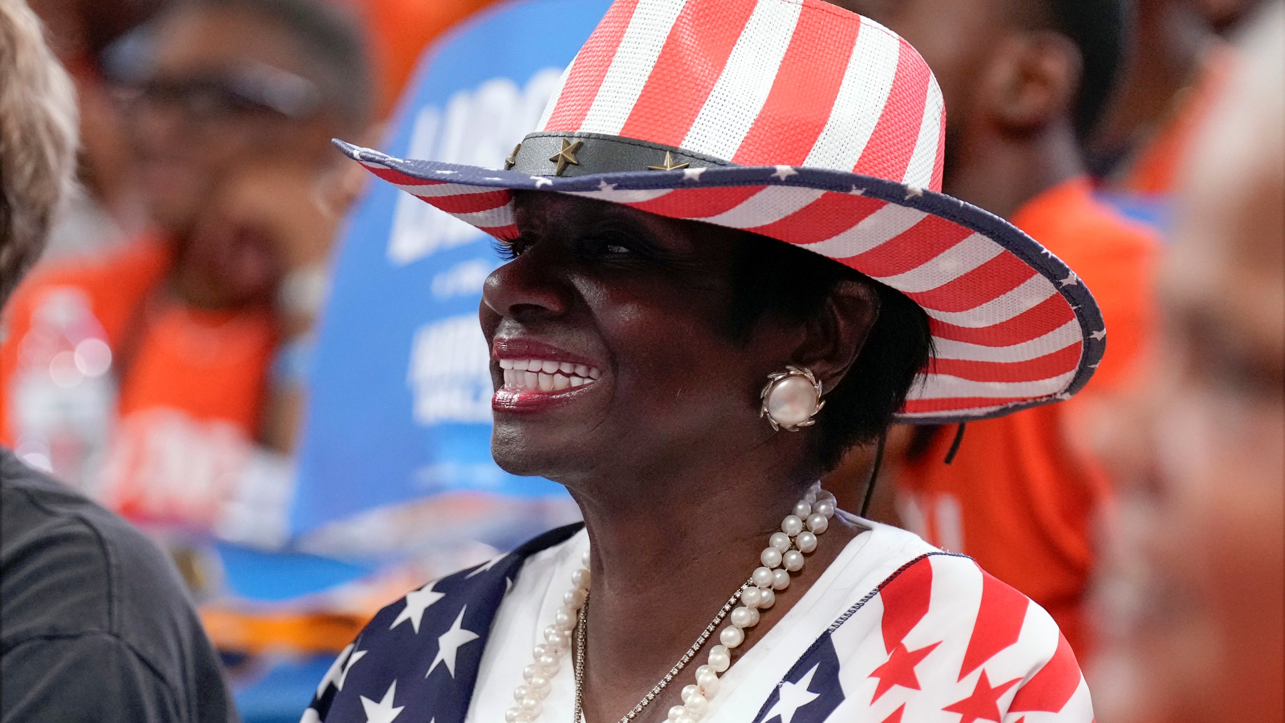 A supporter listens as Democratic presidential nominee Vice President Kamala Harris speaks at a campaign event at Northwestern High School in Detroit, Monday, Sept. 2, 2024. (AP Photo/Jacquelyn Martin)