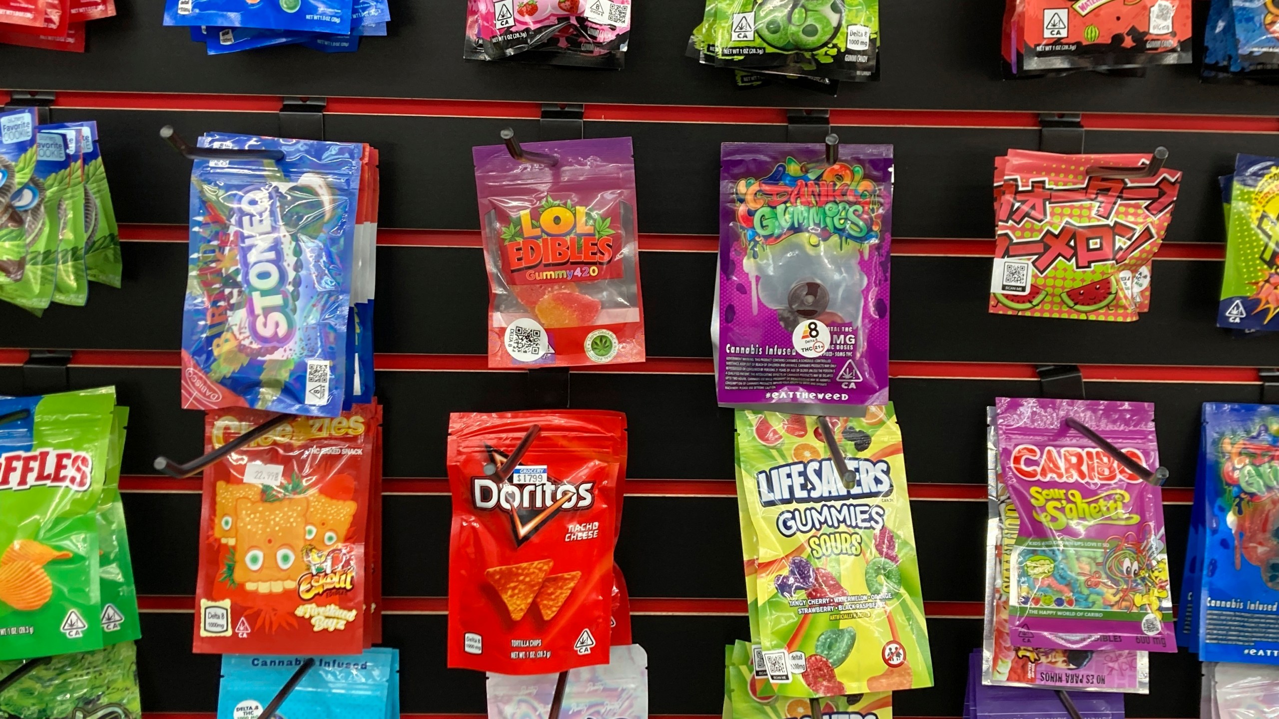 FILE - Products advertised as containing synthetically derived delta-8 THC are offered for sale at a smoke shop in north Seattle on Feb. 25, 2022. (AP Photo/Gene Johnson, File)