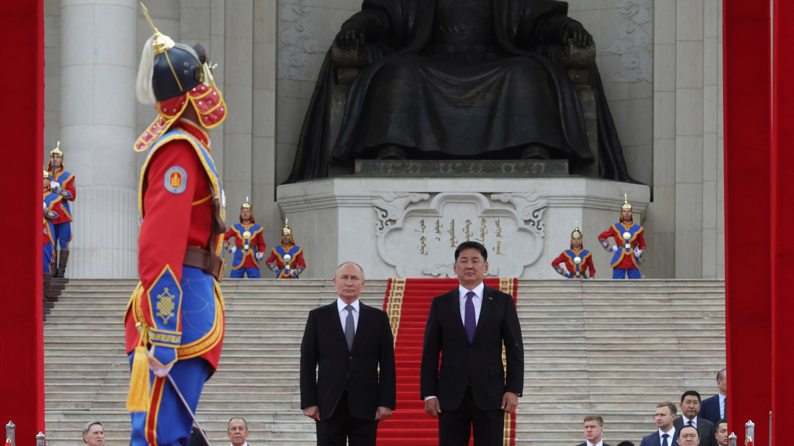 Russian President Vladimir Putin, center left, and Mongolian President Ukhnaagiin Khurelsukh, center right, attend a welcome ceremony in Sukhbaatar Square in Ulaanbaatar, Mongolia, Tuesday, Sept. 3, 2024. (Vyacheslav Prokofyev, Sputnik, Kremlin Pool Photo via AP)