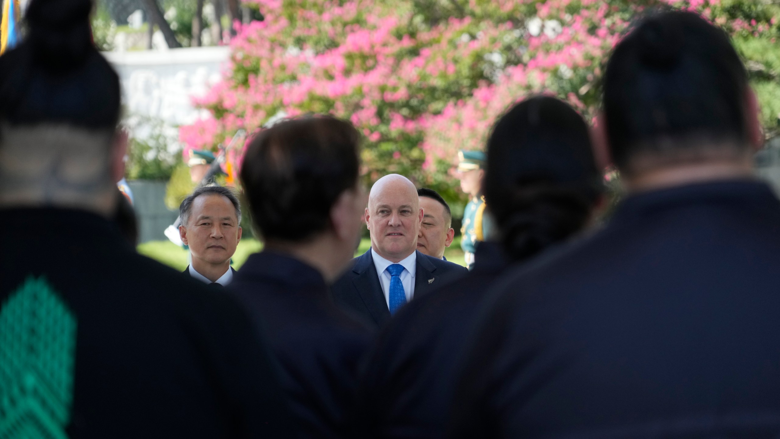 New Zealand's Prime Minister Christopher Luxon, enter, receives a haka waiata during a visit to National Cemetery in Seoul, South Korea, Wednesday, Sept. 4, 2024. (AP Photo/Ahn Young-joon)