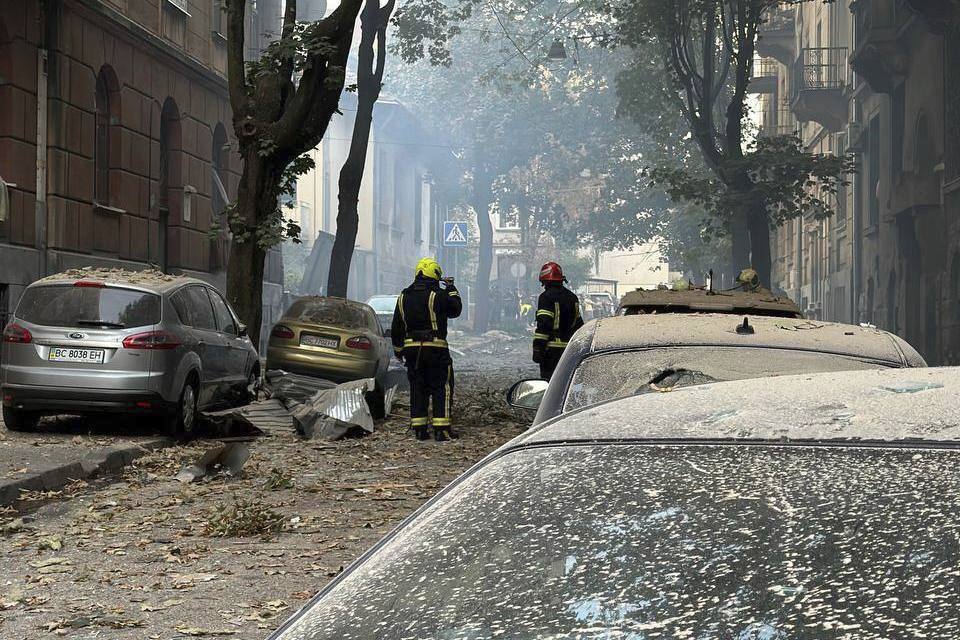 In this photo provided by the Lviv City Council, firefighters work near a residential building damaged by a Russian strike in Lviv, Ukraine, Wednesday, Sept. 4, 2024. (Lviv City Council via AP)