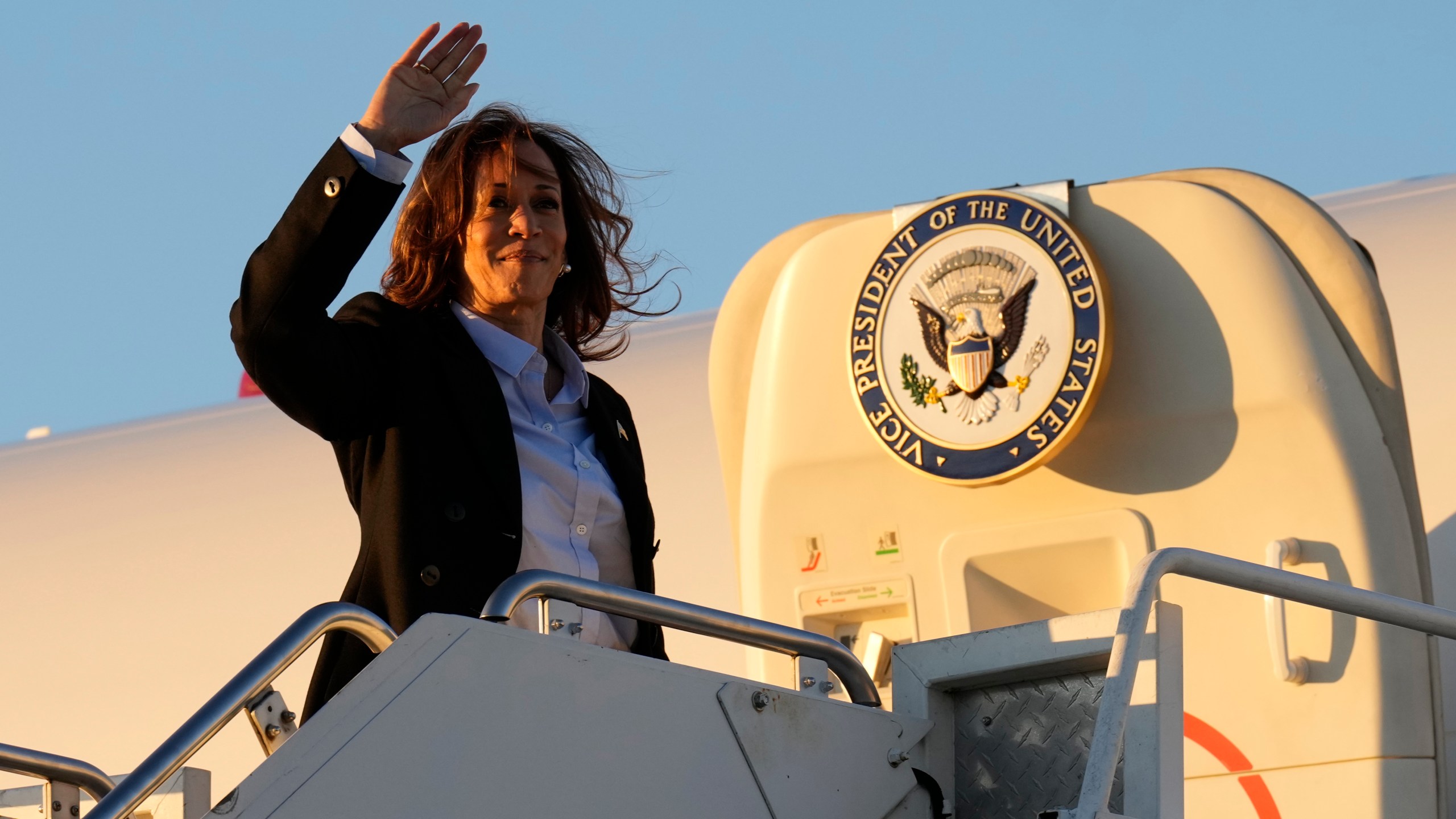 Democratic presidential nominee Vice President Kamala Harris waves as she boards Air Force Two at Pittsburgh International Airport in Pittsburgh, Monday, Sept. 2, 2024. (AP Photo/Jacquelyn Martin)