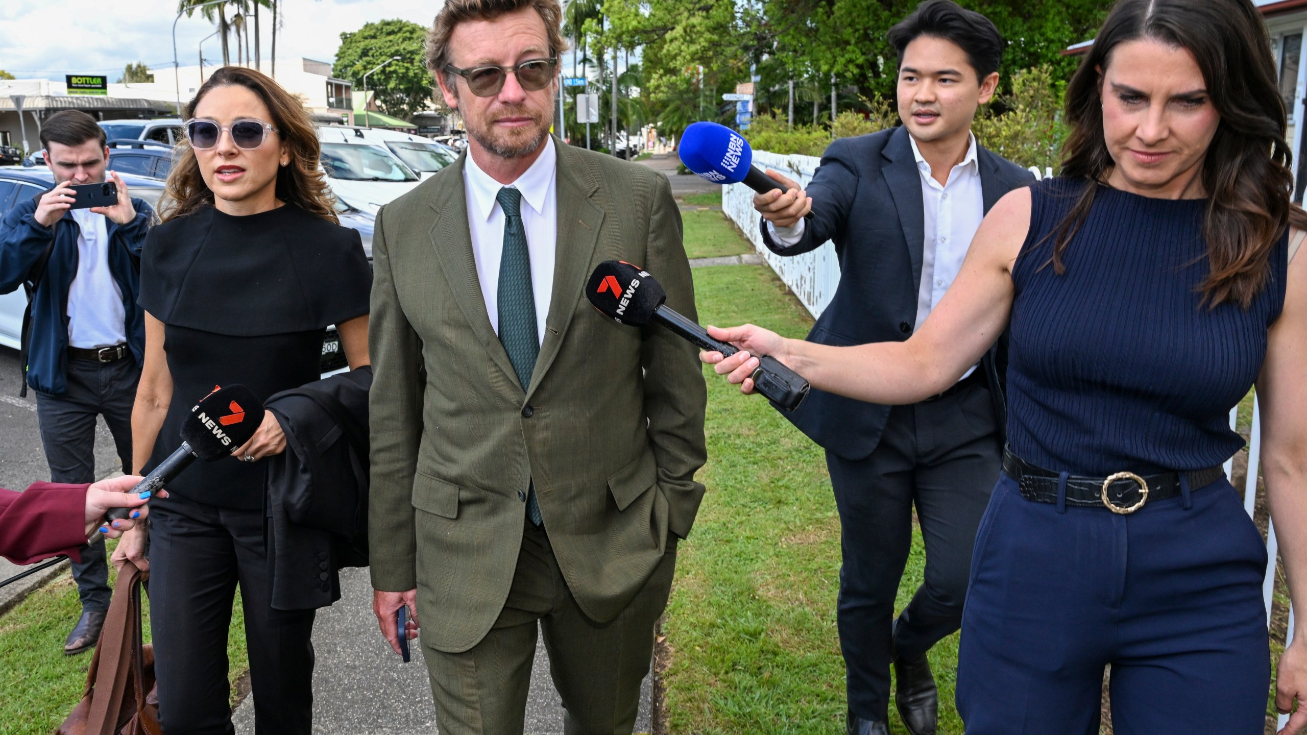 Australian actor and director Simon Baker, center, best known for his role as Patrick Jane in the CBS drama series The Mentalist, arrives at the Mullumbimby Court House, Wednesday, Sept. 11, 2024, for his sentencing hearing for driving under the influence of alcohol near his rural home. (Darren England/AAP Image via AP)