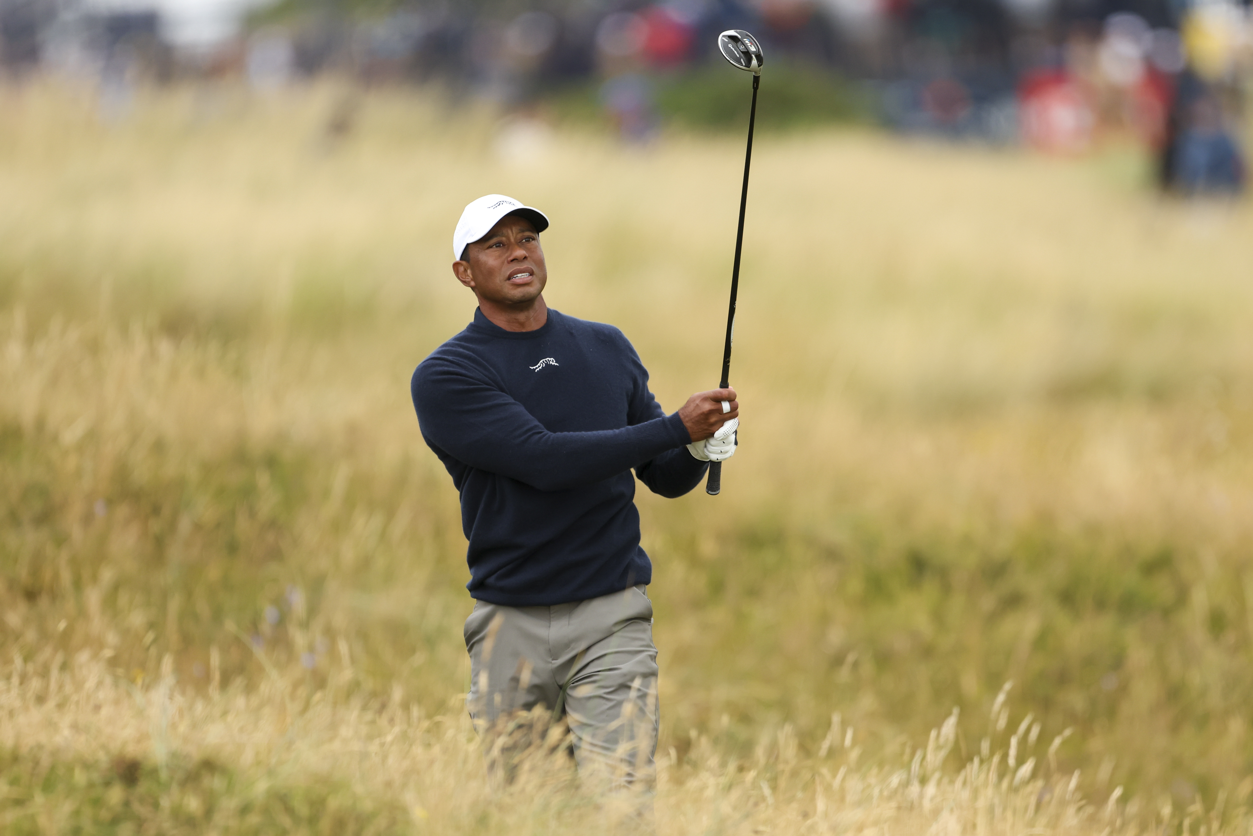 FILE - Tiger Woods of the United States plays from the rough on the sixth hole during his second round of the British Open Golf Championships at Royal Troon golf club in Troon, Scotland, July 19, 2024. (AP Photo/Peter Morrison, File)