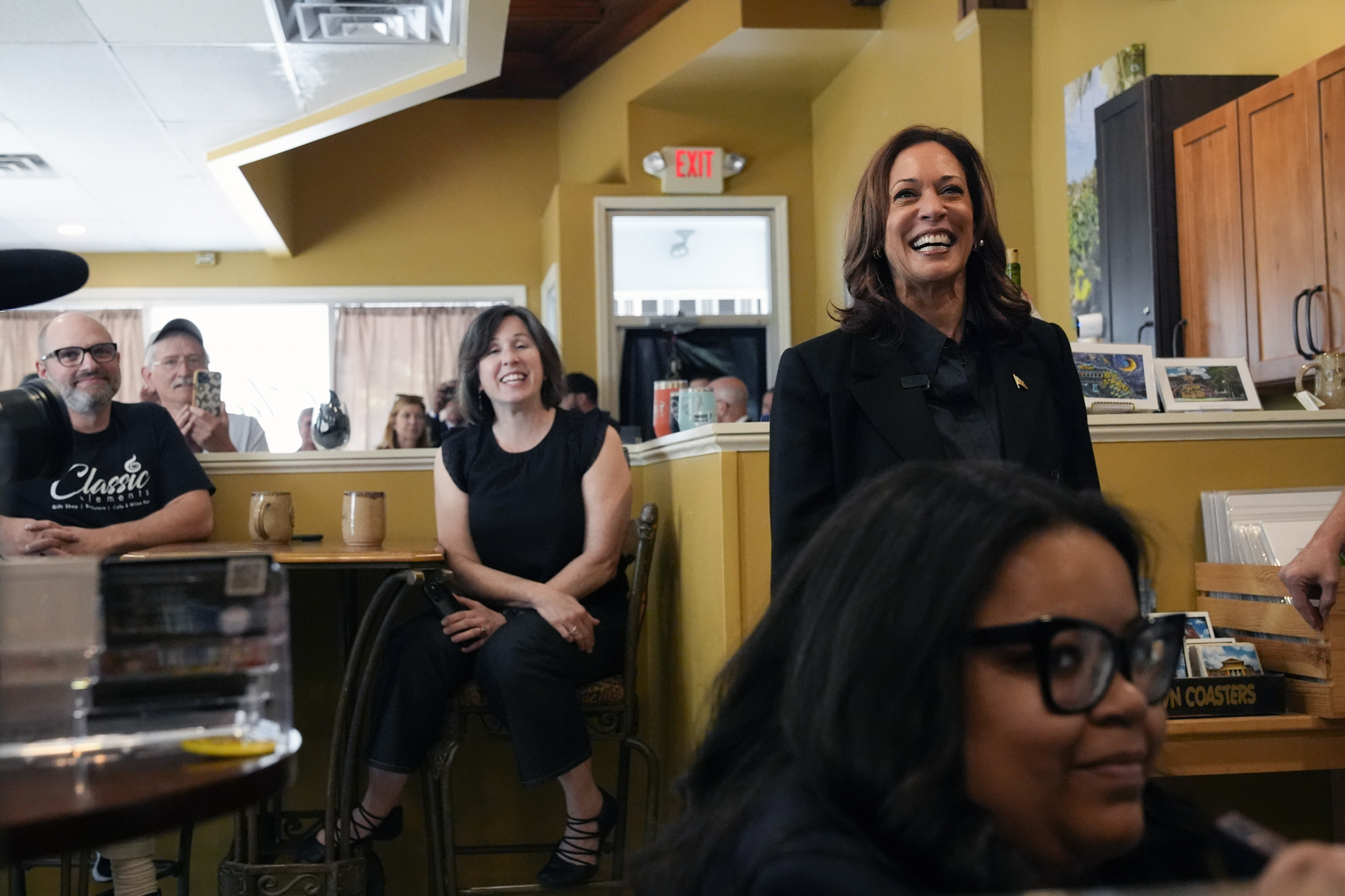 Democratic presidential nominee Vice President Kamala Harris, right, is greeted at Classic Elements, a cafe and bookstore, Friday, Sept. 13, 2024. in Johnstown, Pa. (AP Photo/Jacquelyn Martin)