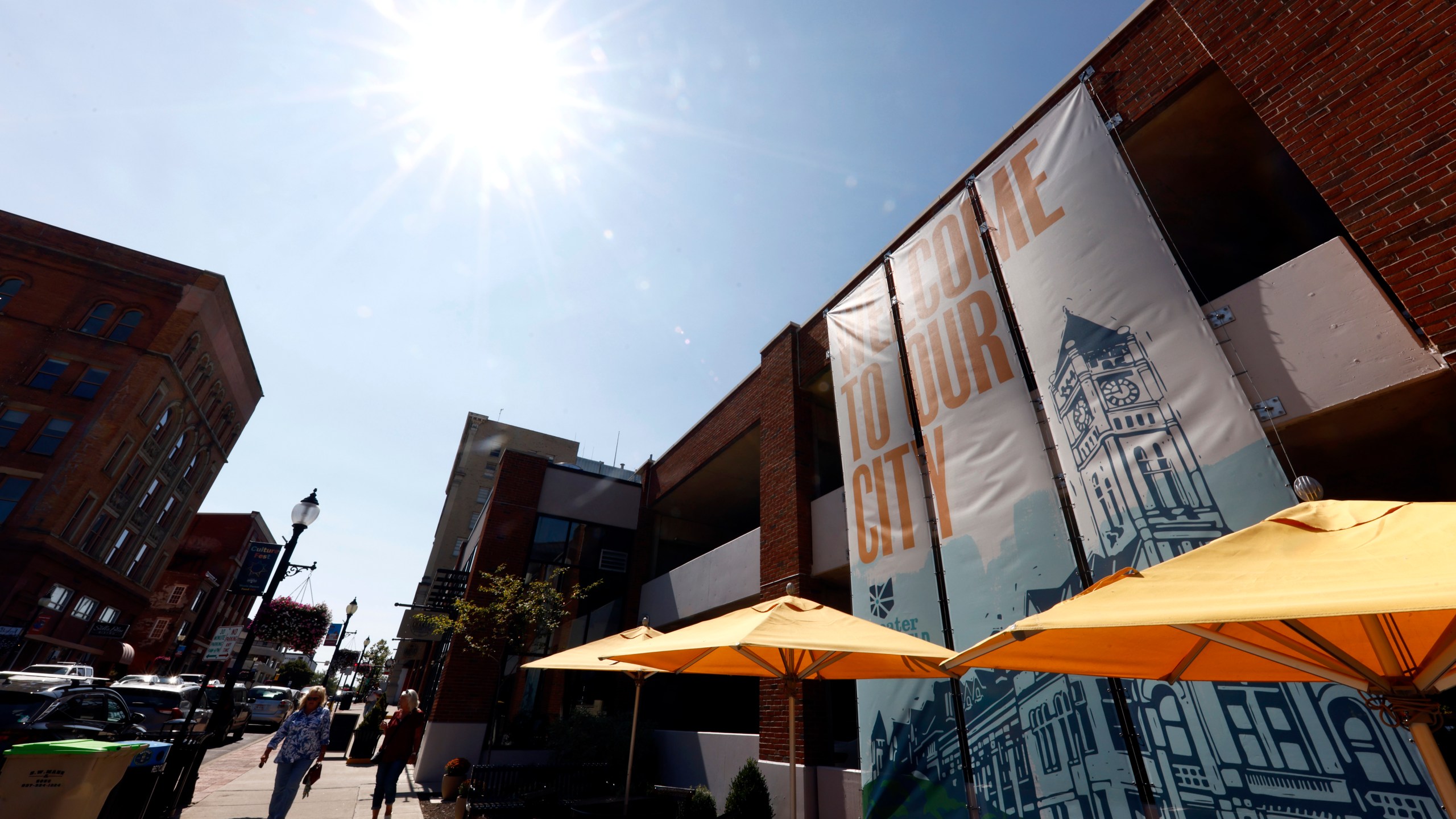 Pedestrians walk down Fountain Avenue in Springfield, Ohio, Wednesday, Sept. 11, 2024. (AP Photo/Paul Vernon)