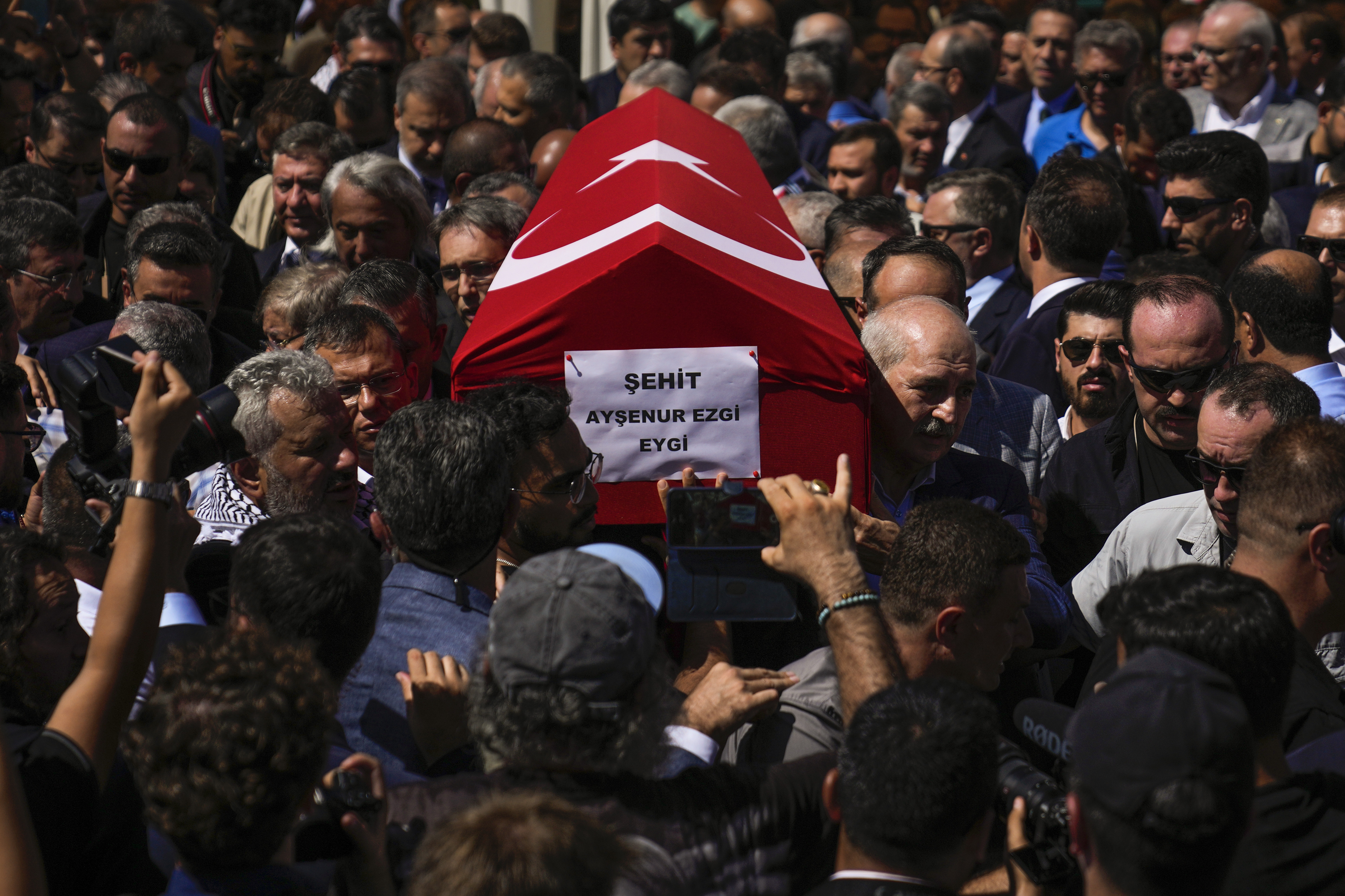 People attend the funeral prayers for Aysenur Ezgi Eygi, 26 year-old Turkish-American activist killed by the Israeli military, outside the central mosque of City of Didim, Turkey, Saturday, Sept. 14, 2024. (AP Photo/Khalil Hamra)