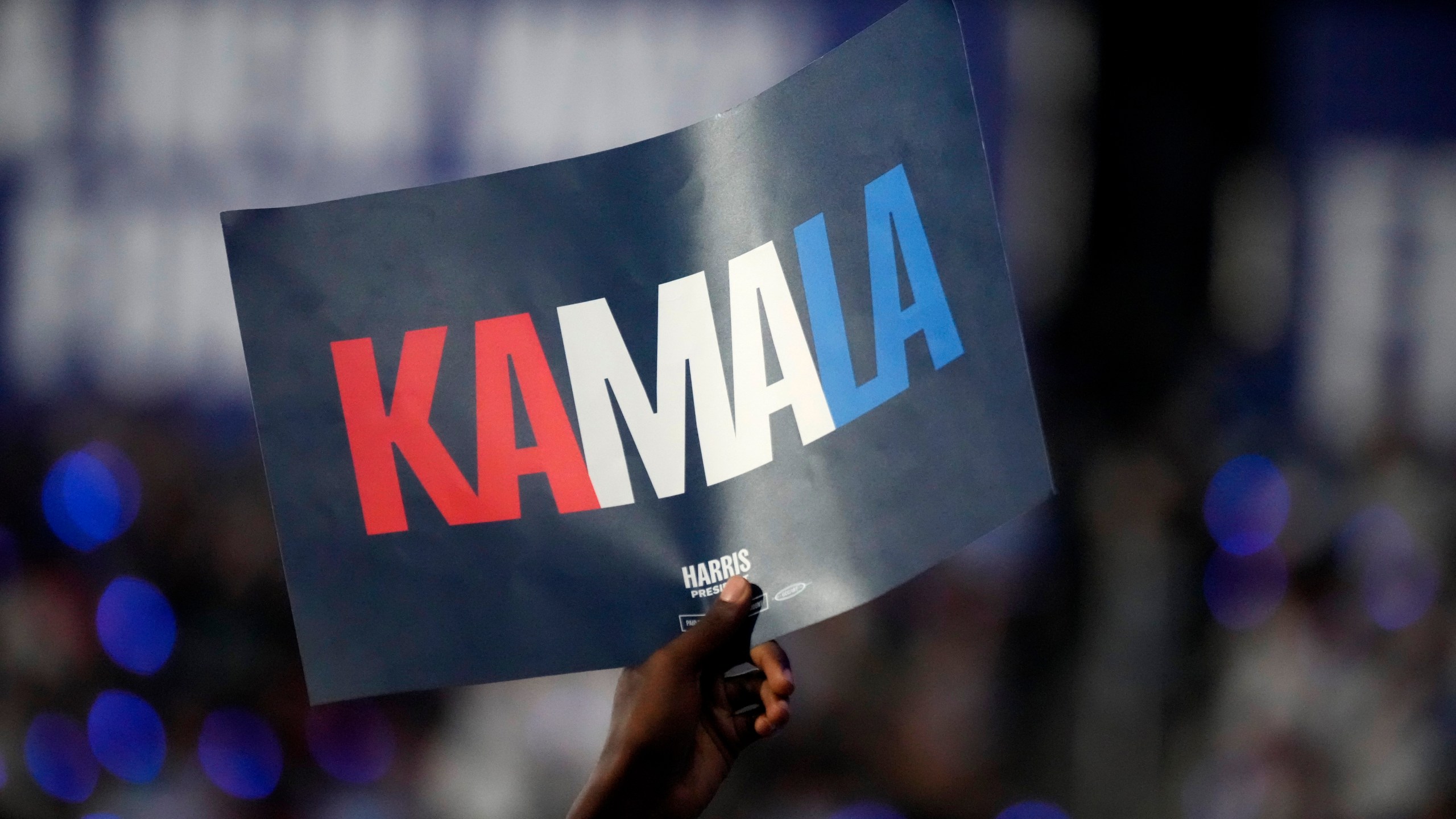 A supporter holds up a sign as Democratic presidential nominee Vice President Kamala Harris speaks during a campaign event, Thursday, Sept. 12, 2024, in Greensboro, N.C. (AP Photo/Chris Carlson)