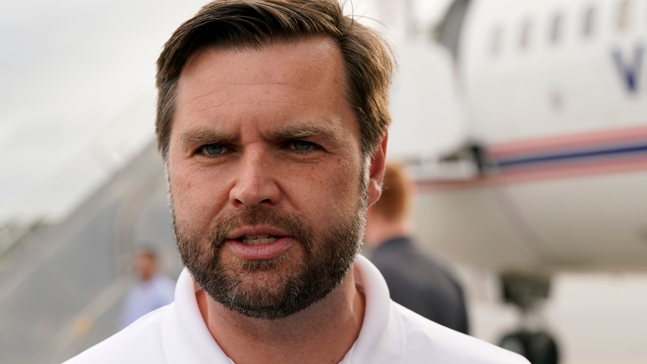 Republican vice presidential nominee Sen. JD Vance, R-Ohio, speaks to reporters before he departs Pitt-Greenville Airport following a campaign event in Greenville, N.C., Saturday Sept. 14, 2024. (AP Photo/Steve Helber)