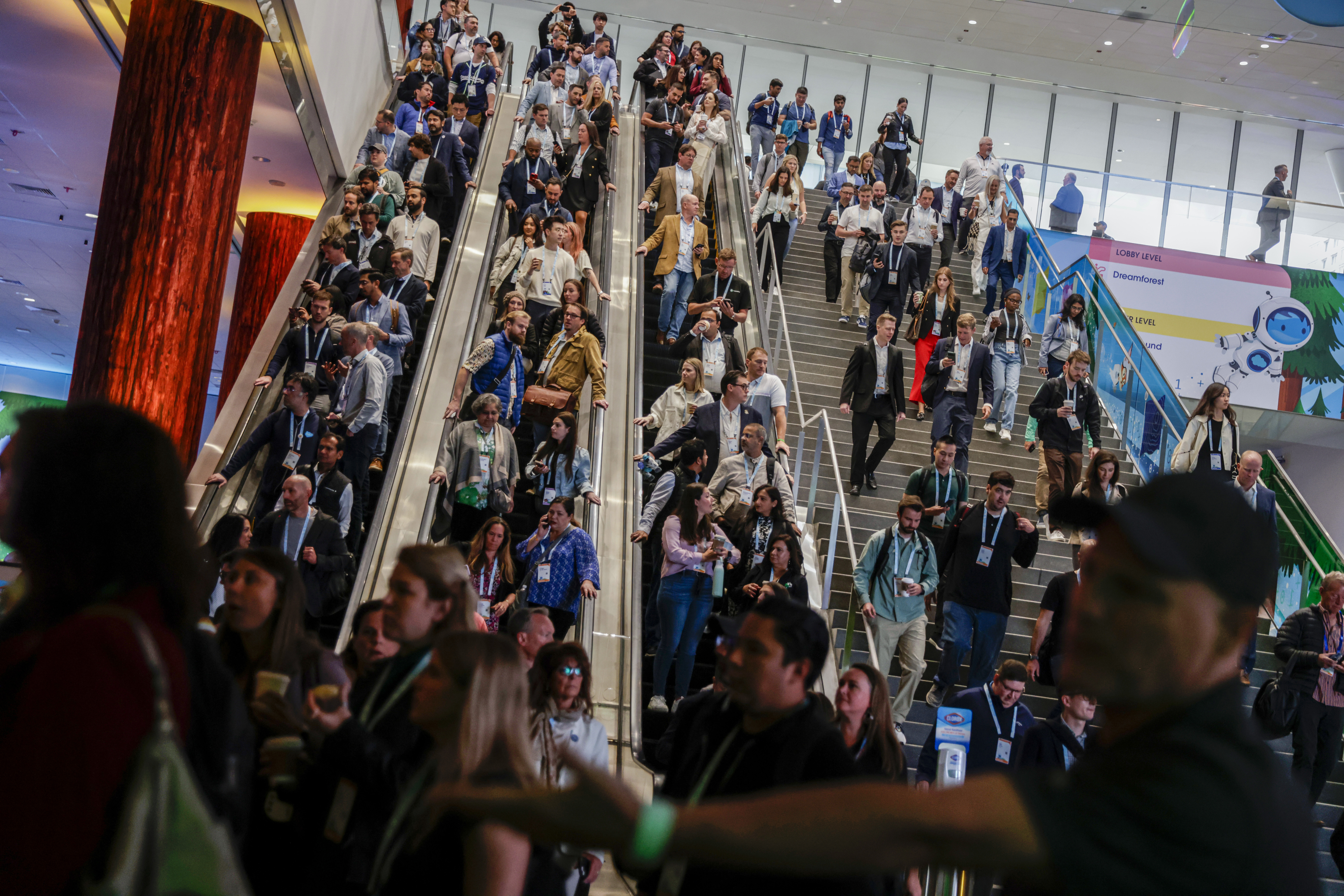 Thousands make their way to the Moscone South Hall in preparation for keynote speakers, including Salesforce CEO Marc Benioff, during Dreamforce in San Francisco on Tuesday, Sept. 17, 2024. (Brontë Wittpenn/San Francisco Chronicle via AP)