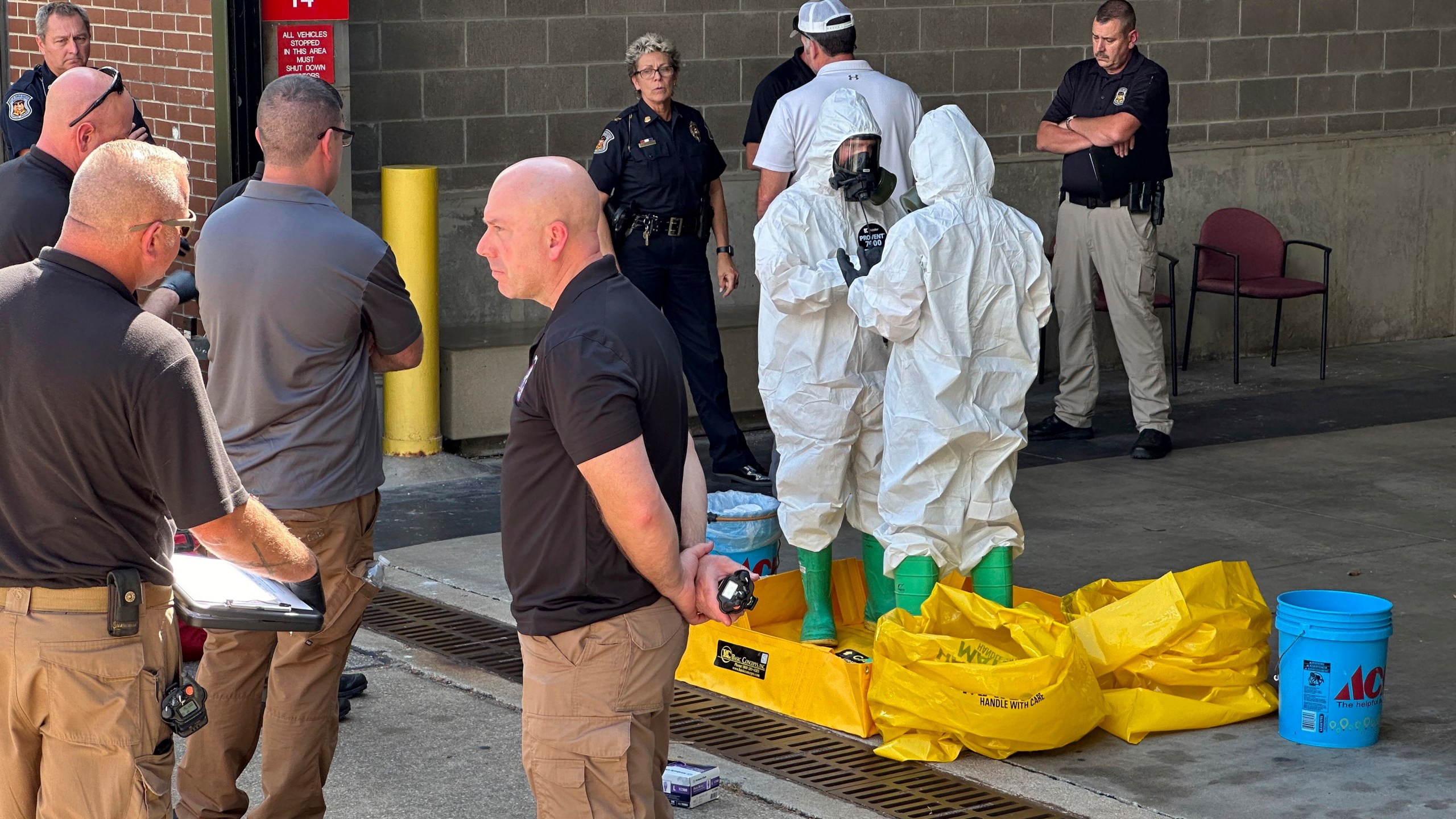 A hazmat crew from the National Guard's Civilian Support Team investigates after a suspicious package was delivered to election officials at the Missouri Secretary of State's Jefferson City, Mo., office on Tuesday Sept. 17, 2024. (AP Photo/Summer Ballentine)